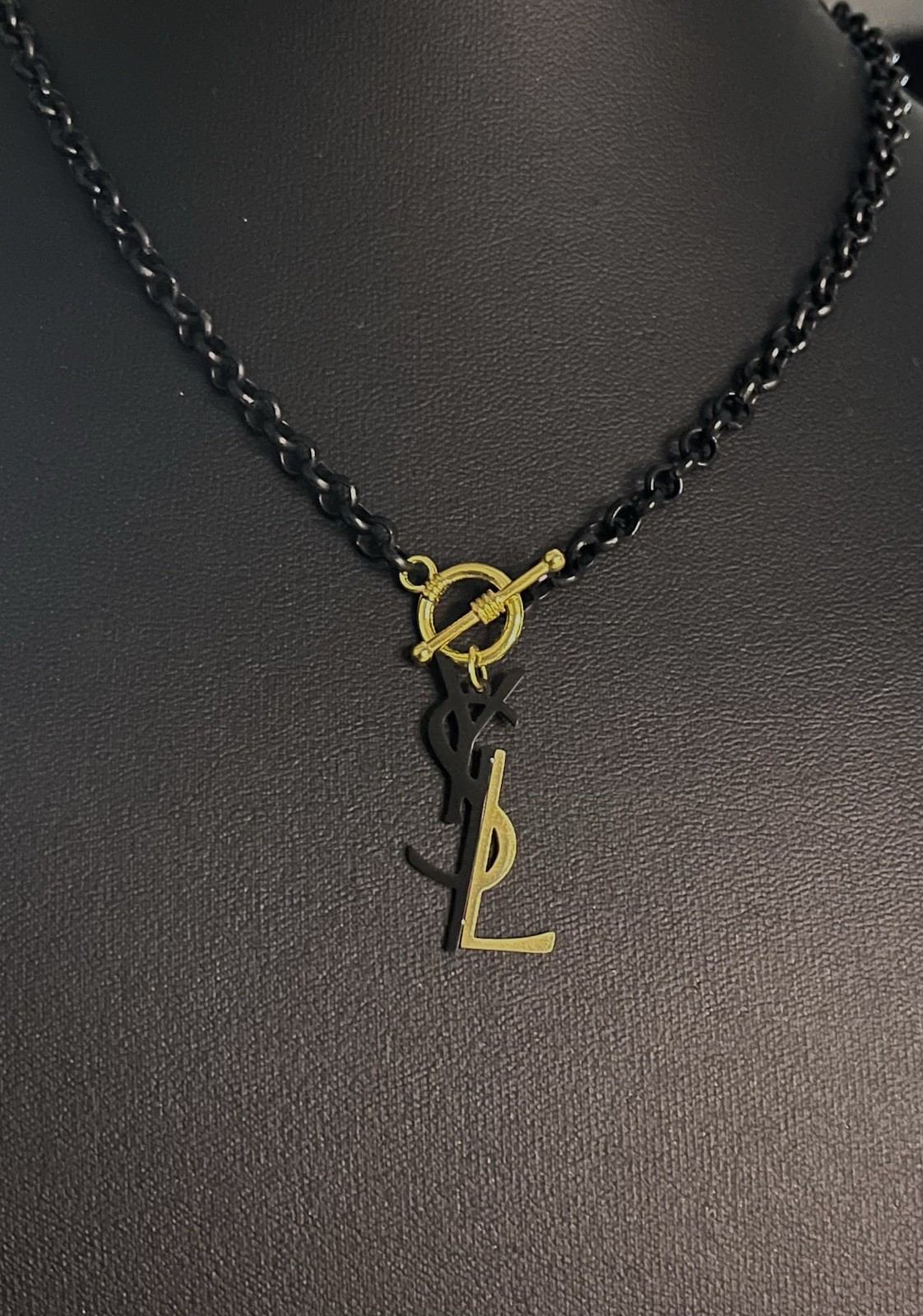 Mixed Metal Zipper Pull Charm On Black Rolo Toggle Necklace