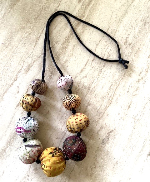 Multicolored fabric and cord adjustable necklace (14″ inch drop)
