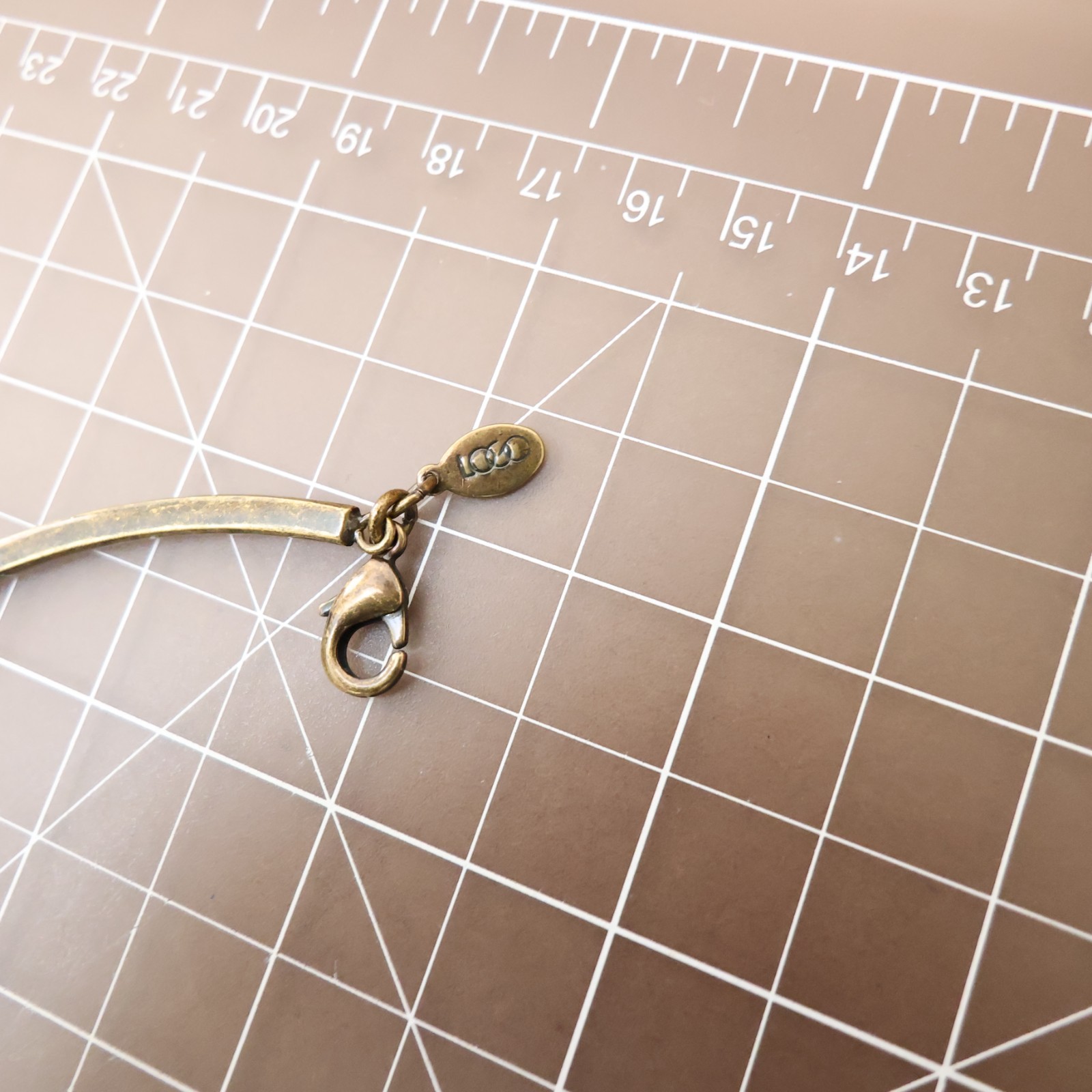 Logo Links necklace Lori Goldstein ivory crystals statement collar bronzetone