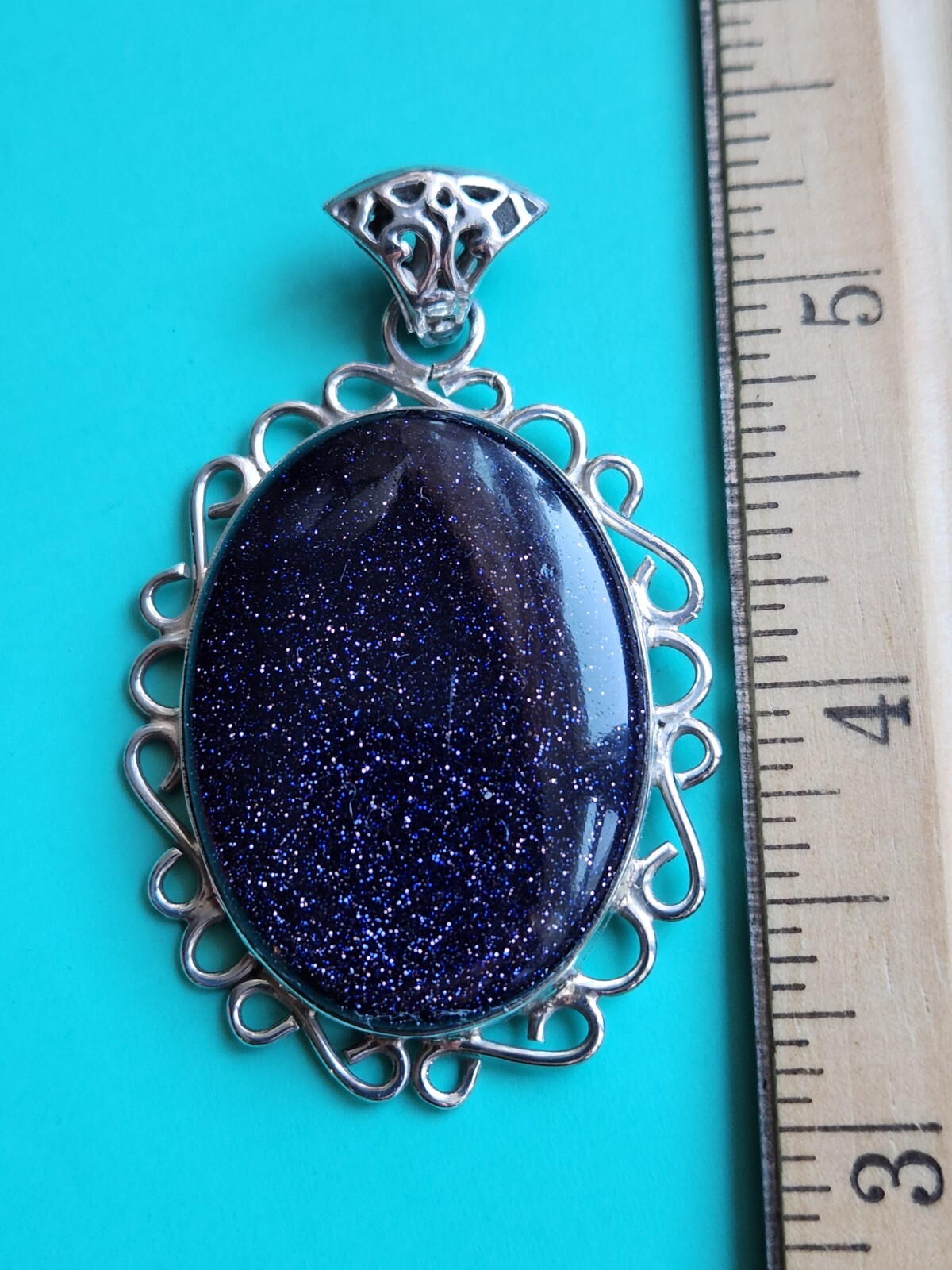 BLUE GOLDSTONE STERLING SILVER PENDANT, 17 GRAMS