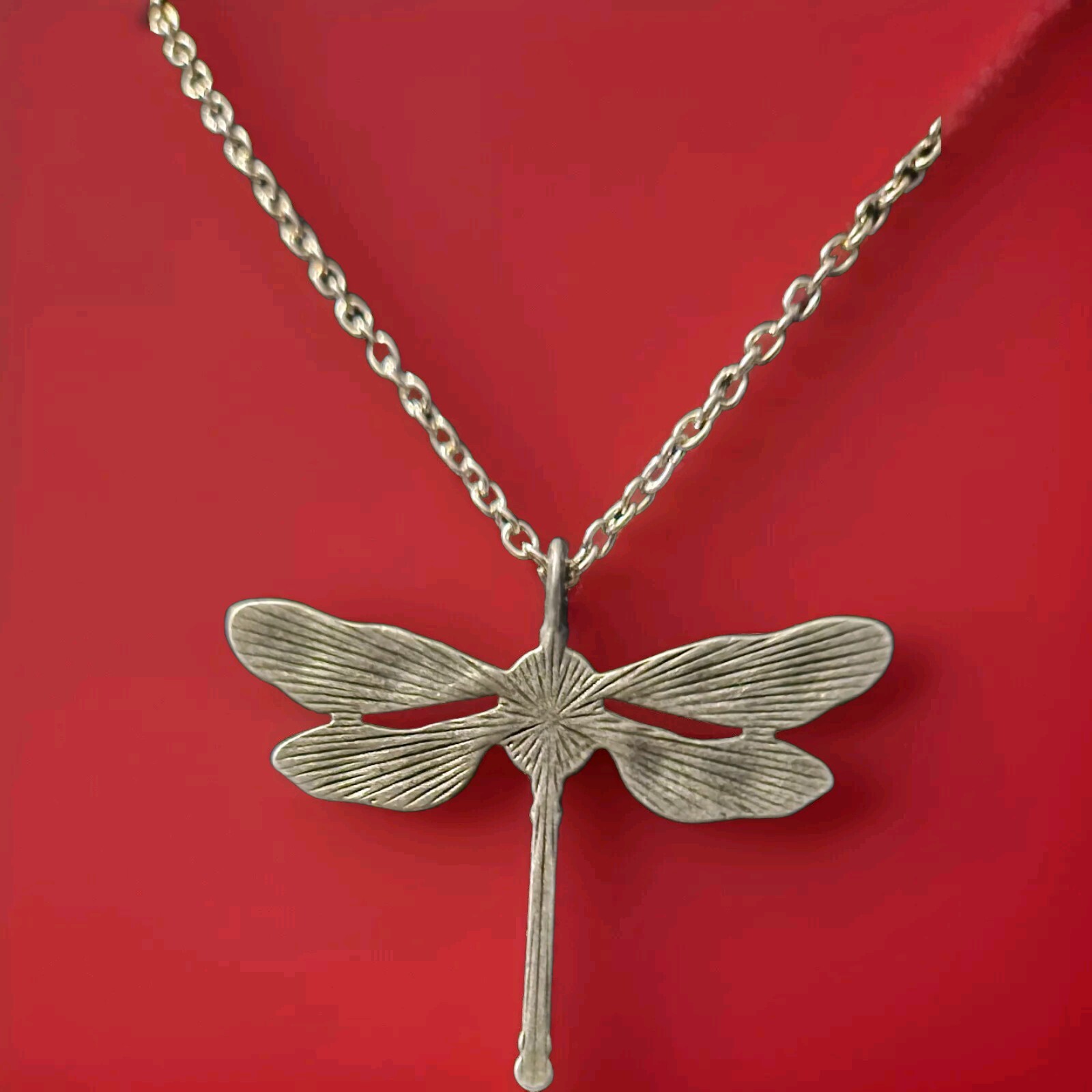 Silvery Dragonfly Shaped Pendant with a White Inlaid Synthetic Zircon Gem