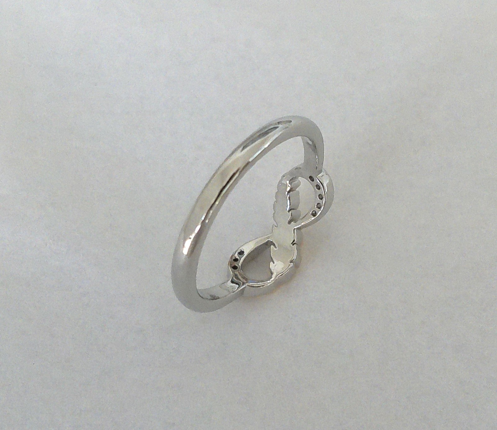 New Silvertone Eternal Infinity Loop with Goldtone Feather Accent Ring Size 7.75