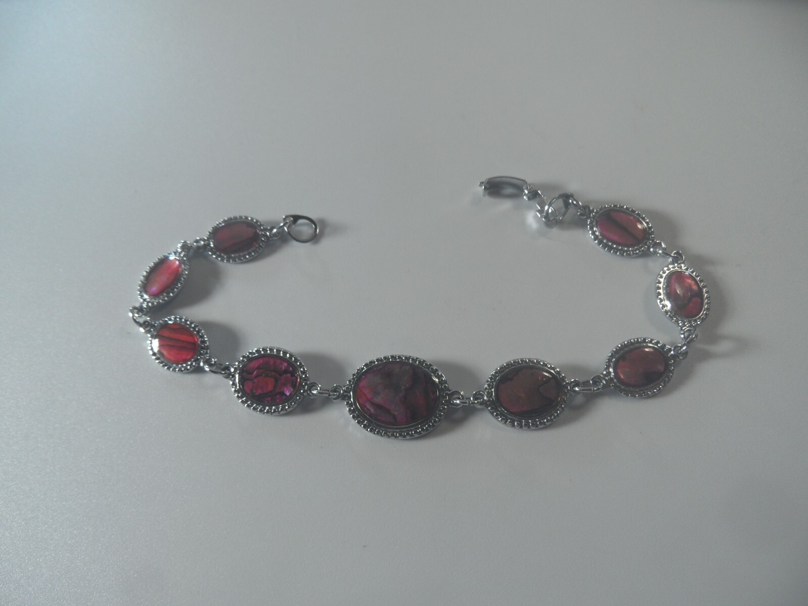 D2- 47 costume jewelry 7″ bracelet silvertone with faux abalone design