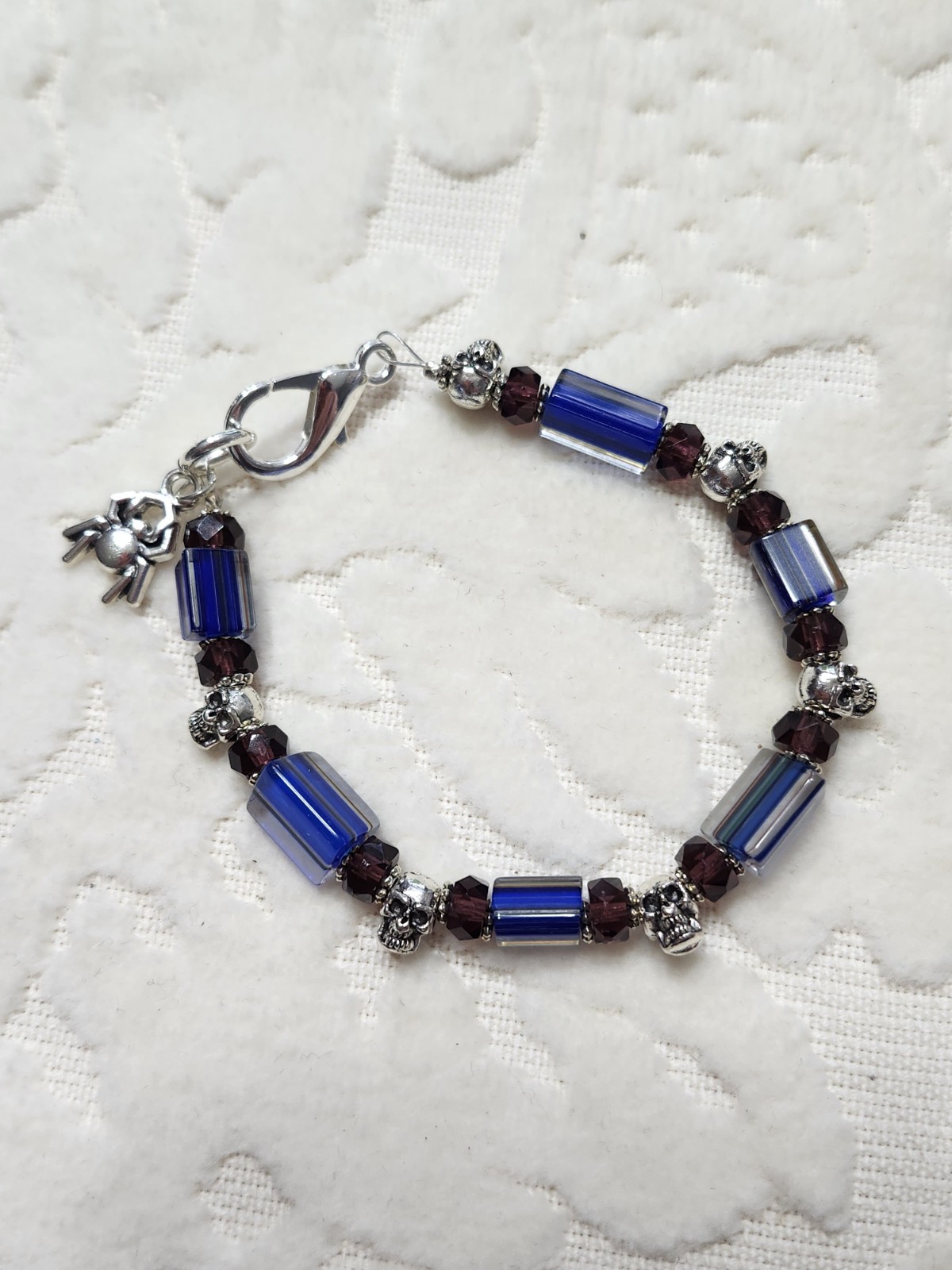 Blue Handblown Glass Beads, silver metal skull, purple crystal beaded Bracelet