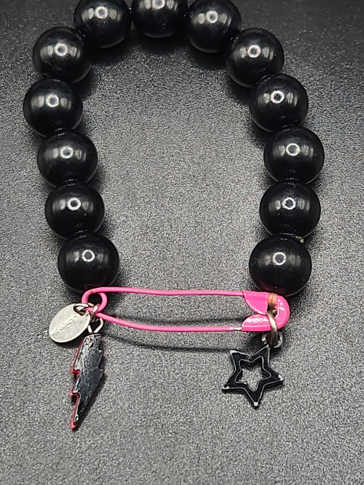 #0351 – Claire’s Black Beaded Stretch Bracelet Pink Safety Pin Lightning Bolt…