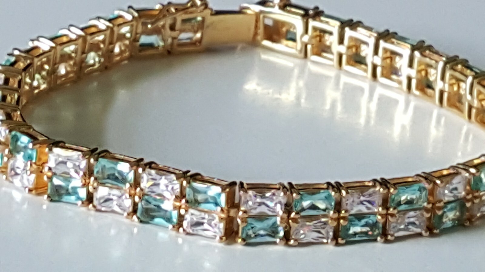 TECHNIBOND Aqua and White DBL ROW YELLOW GOLD plated bracelet. 8 in