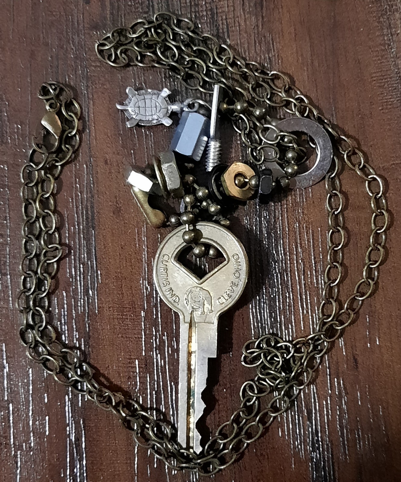 27 Inch Steampunk Necklace With Brass Key, Nuts, Washers, and Turtle Made In USA