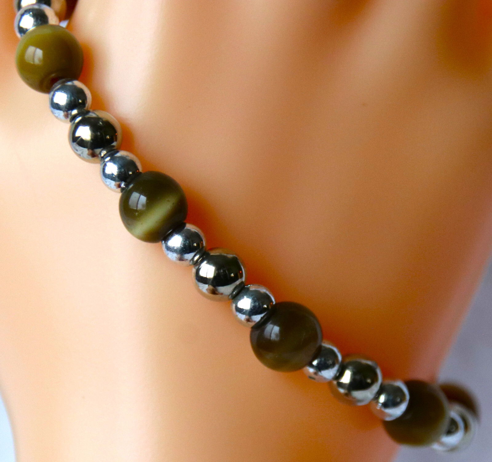 Bracelet of Brown Cat’s Eye Glass with silver colored beads, toggle closure