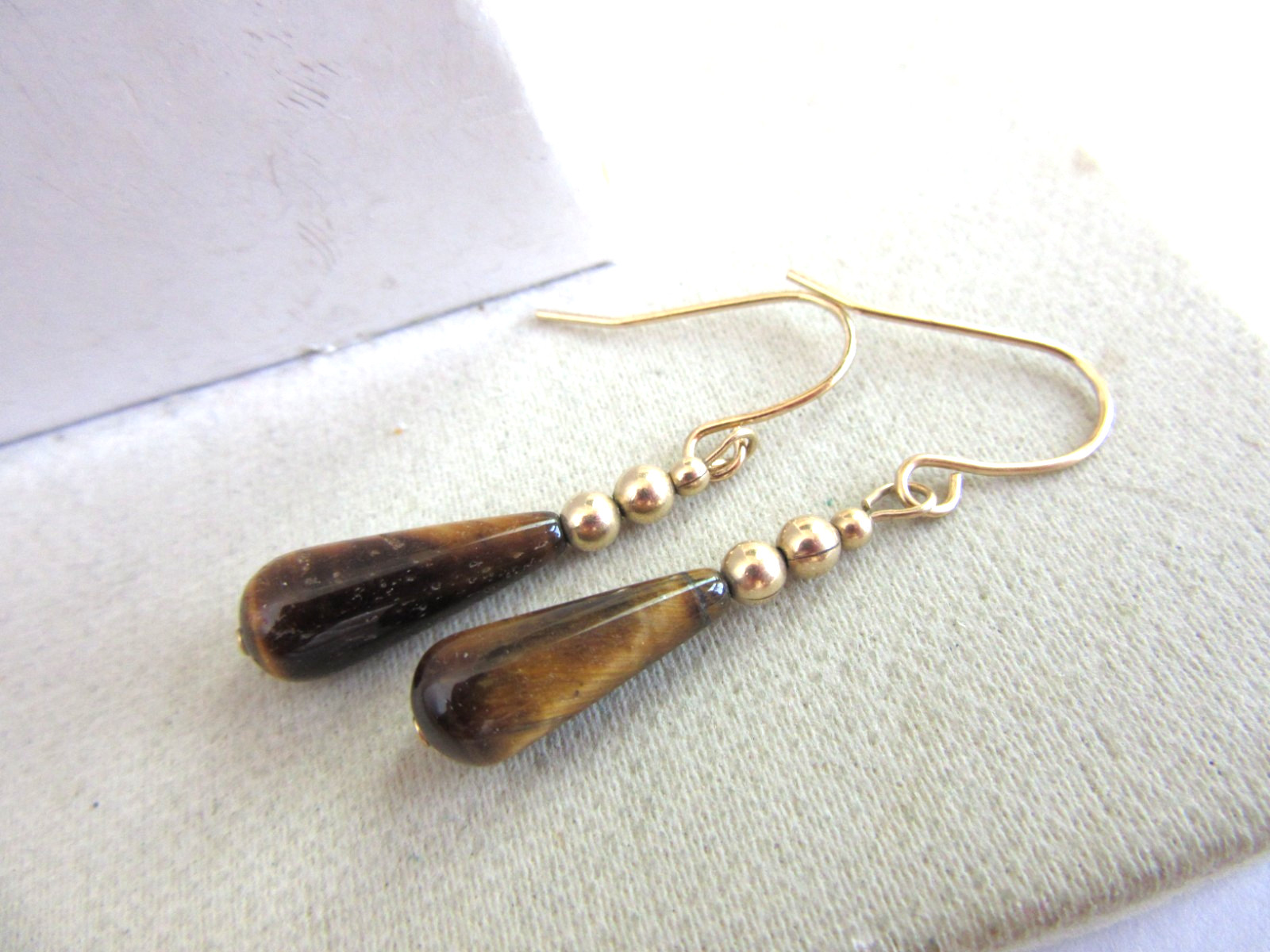 Gold tone hook pierced earrings with teardrop Tigers eye beads