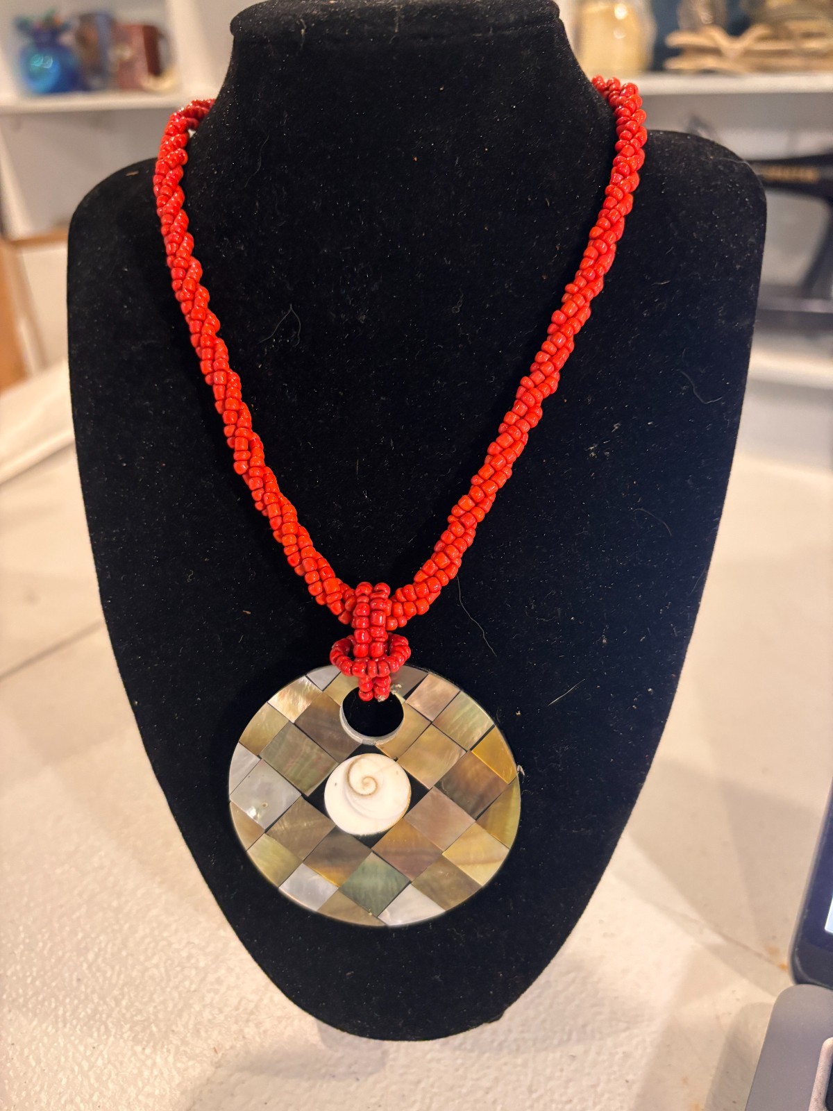 Abalone and shiva shell pendant on red beaded necklace
