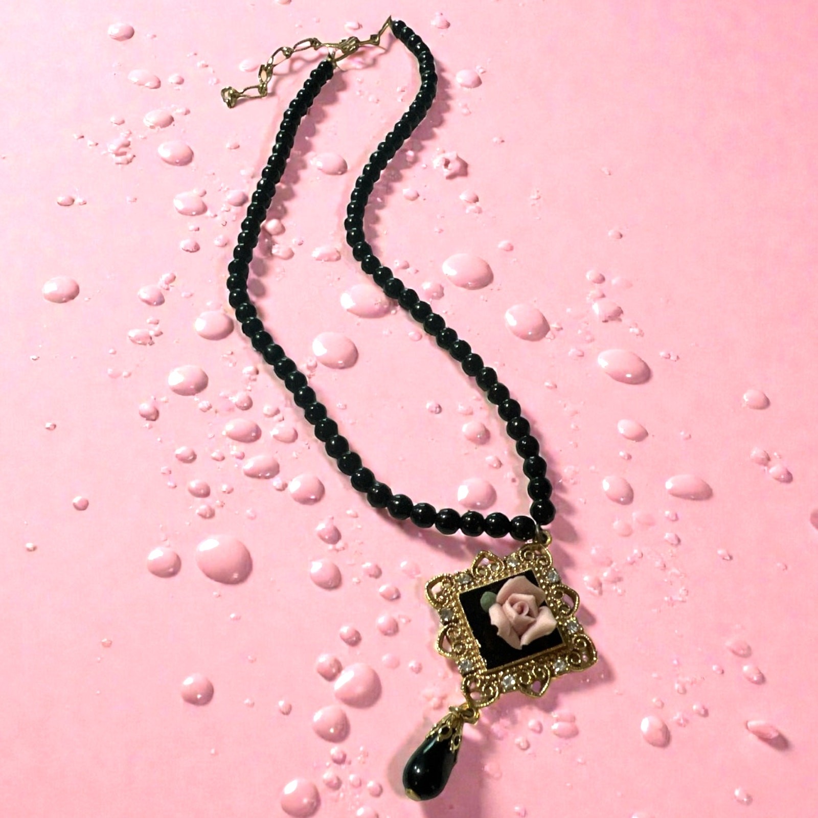 Vintage 1928 Jewelry Co with Black Beads and Gold-tone Pendant w/Pink Rose