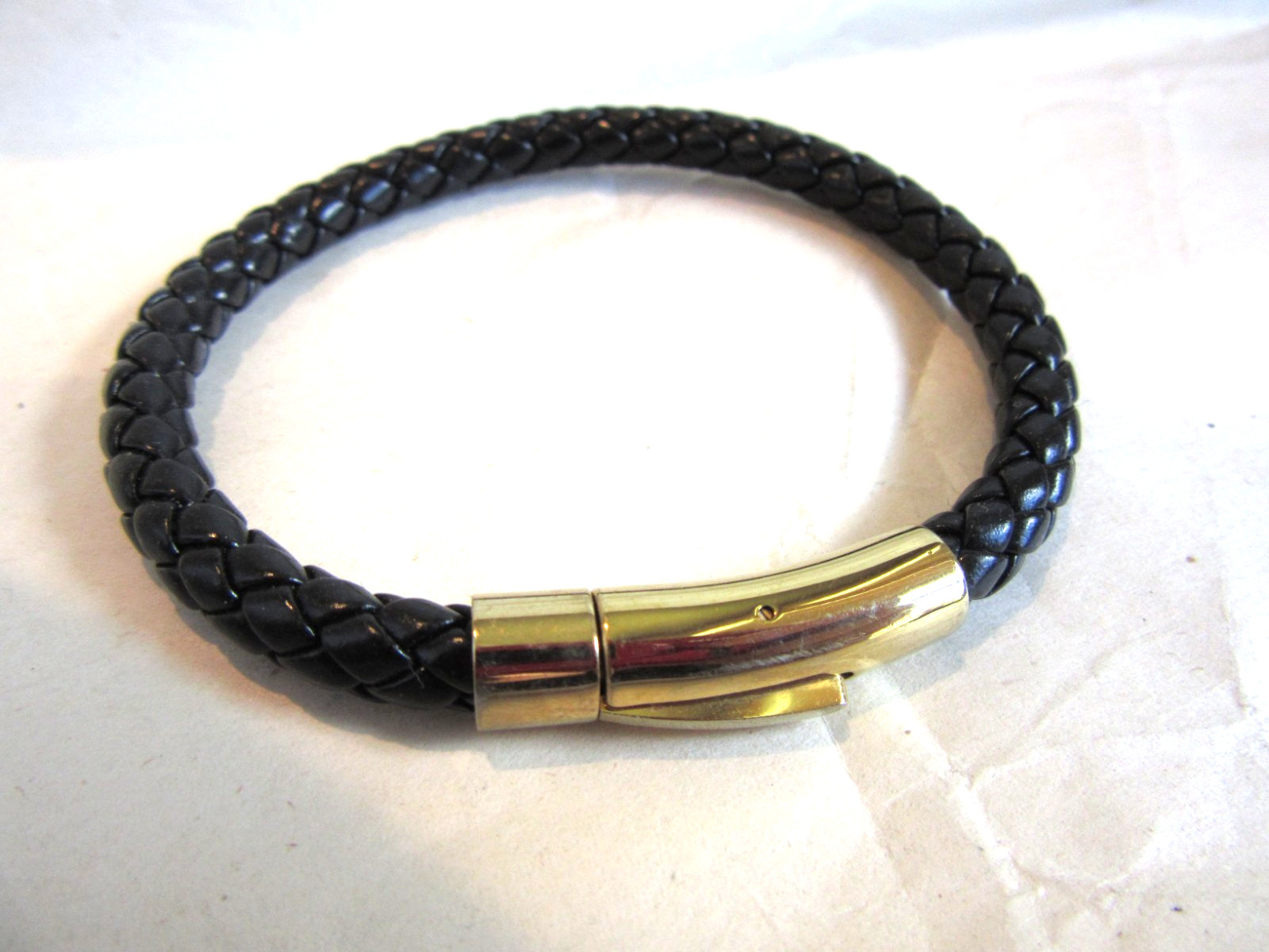 Black braided faux leather bracelet with a push lock clasp