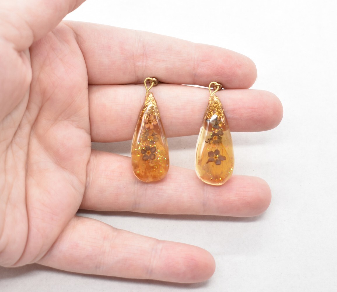 2 1/8″ Gold Glitter & Tiny Blue Forget-Me-Nots in Faux Amber Resin Hook Earrings