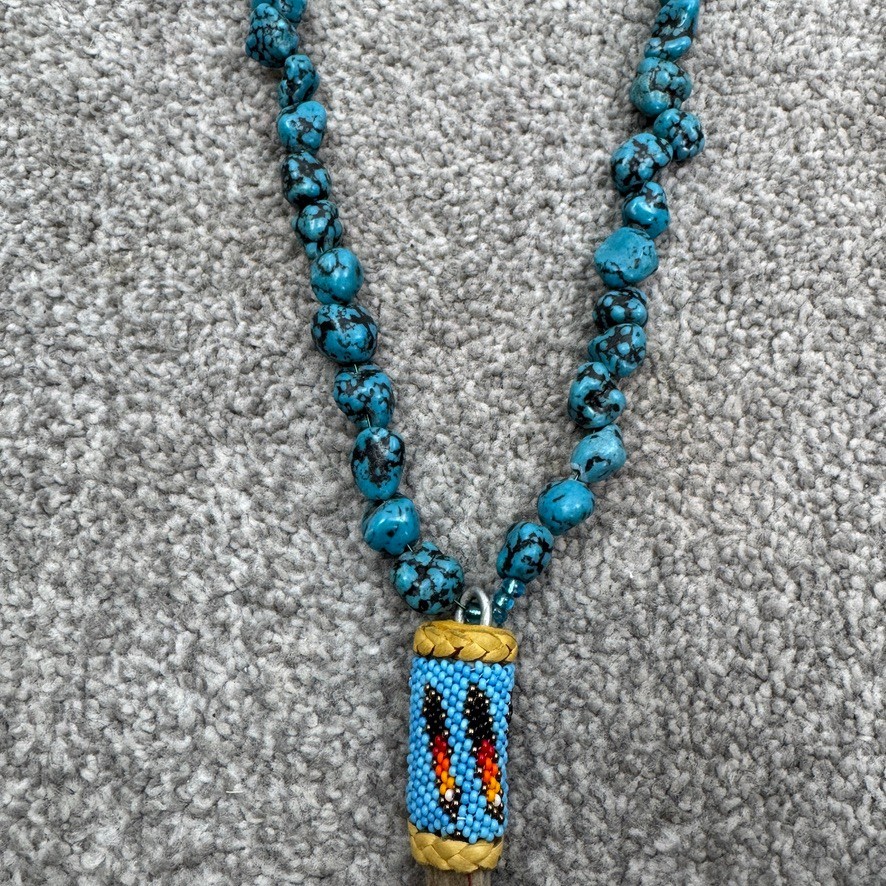 Handmade Necklace With Bone Pendant Wrapped In Beading On Blue Speckled Stones
