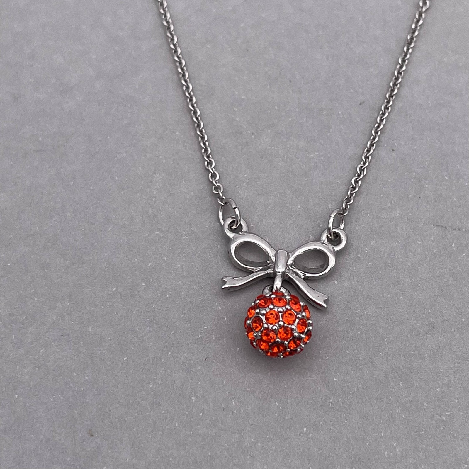 Clue Rhinestone Ball and Bow Link Chain Necklace Silver Tone 15 to 17 in