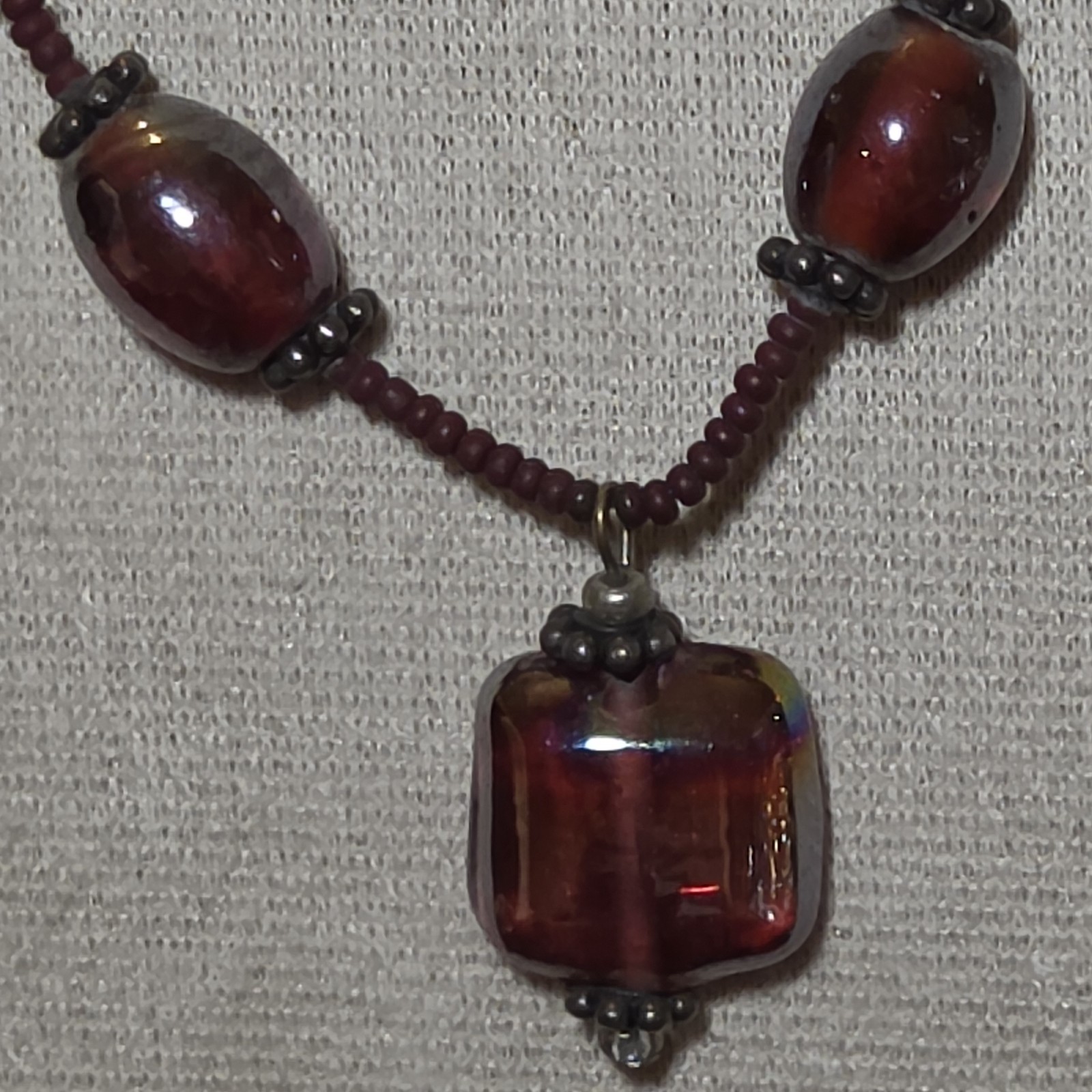 Burgundy Glass Beaded Necklace With Pendant.