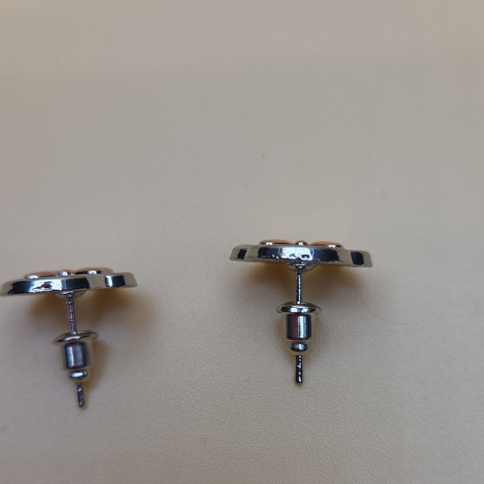 Silver and Rose Tone Ear And Bow Stud Earrings with Butterfly Back Closure