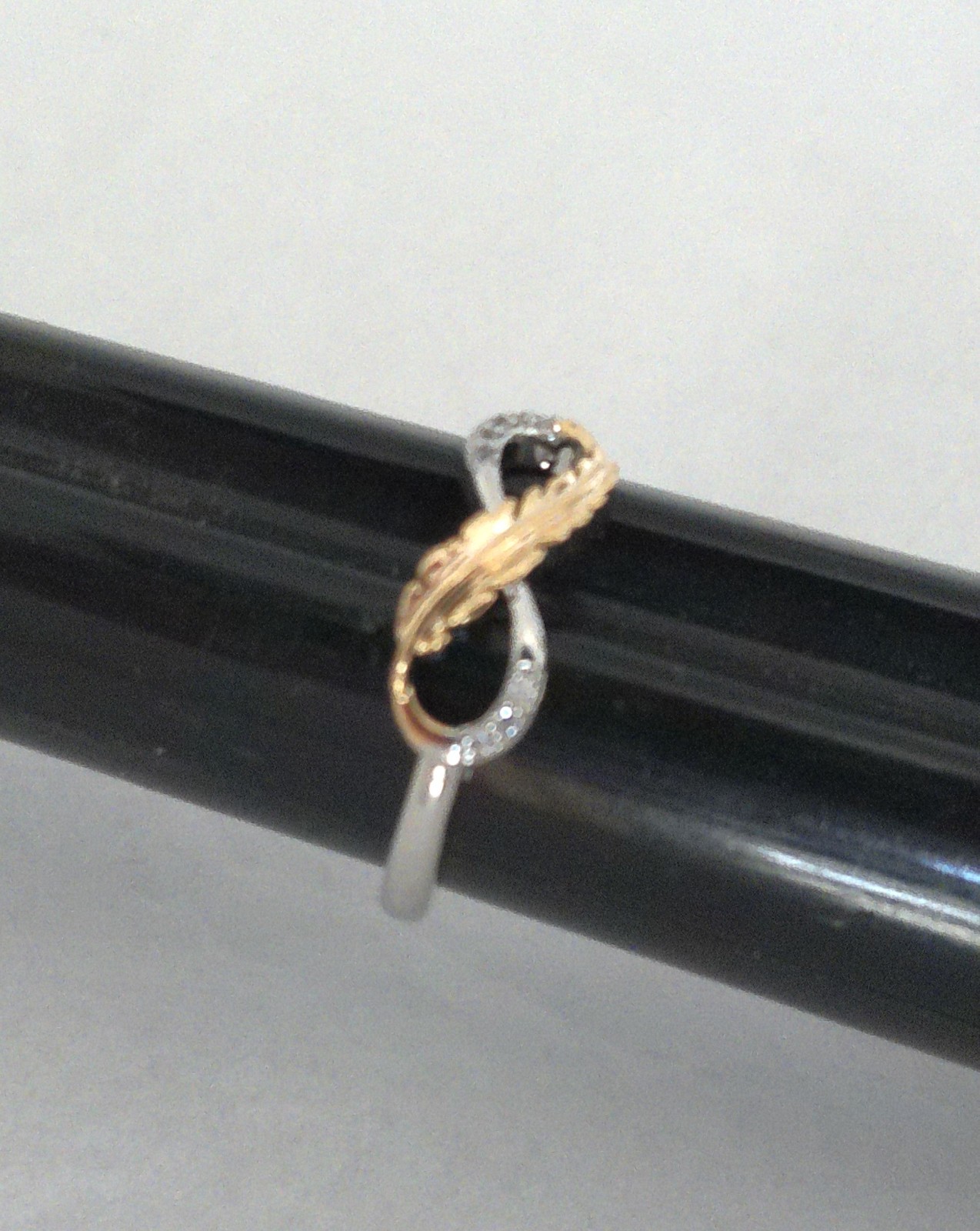 New Silvertone Eternal Infinity Loop with Goldtone Feather Accent Ring Size 7.75