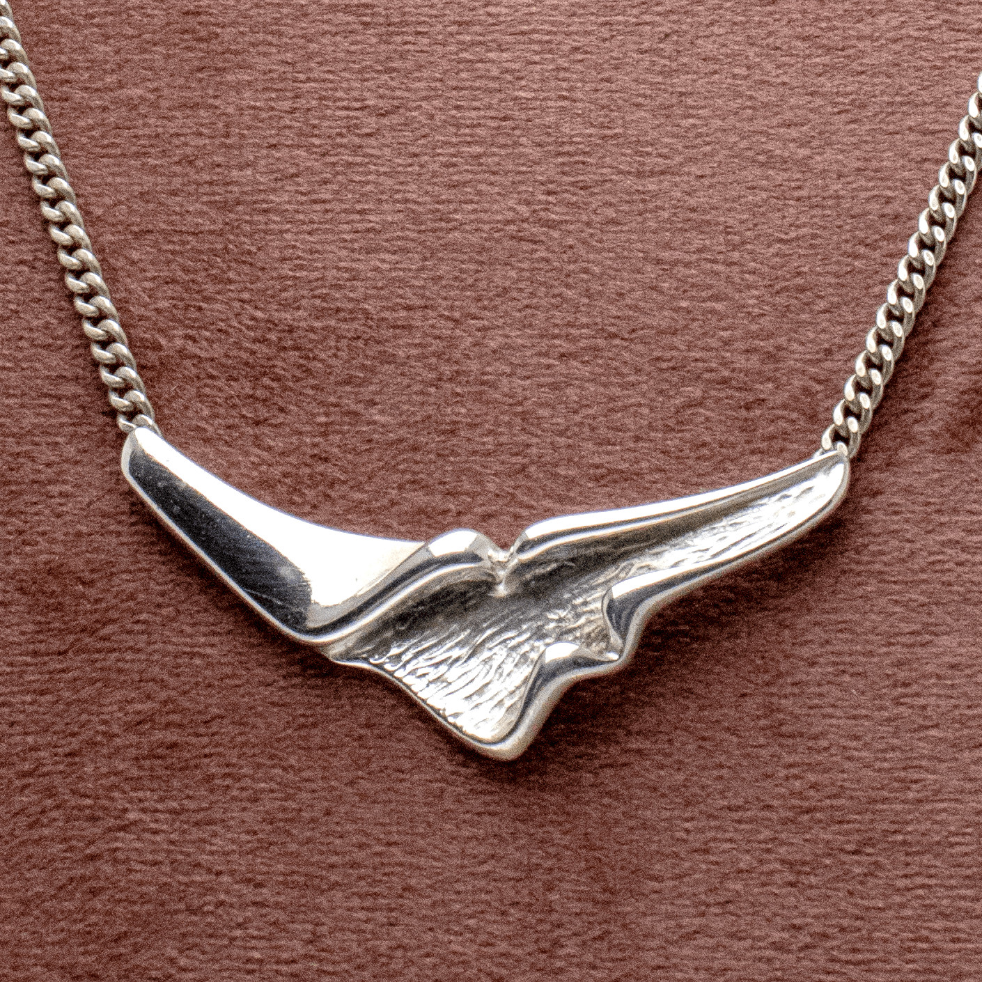 Short necklace with 3D triangle pendant in silver – stylish choice
