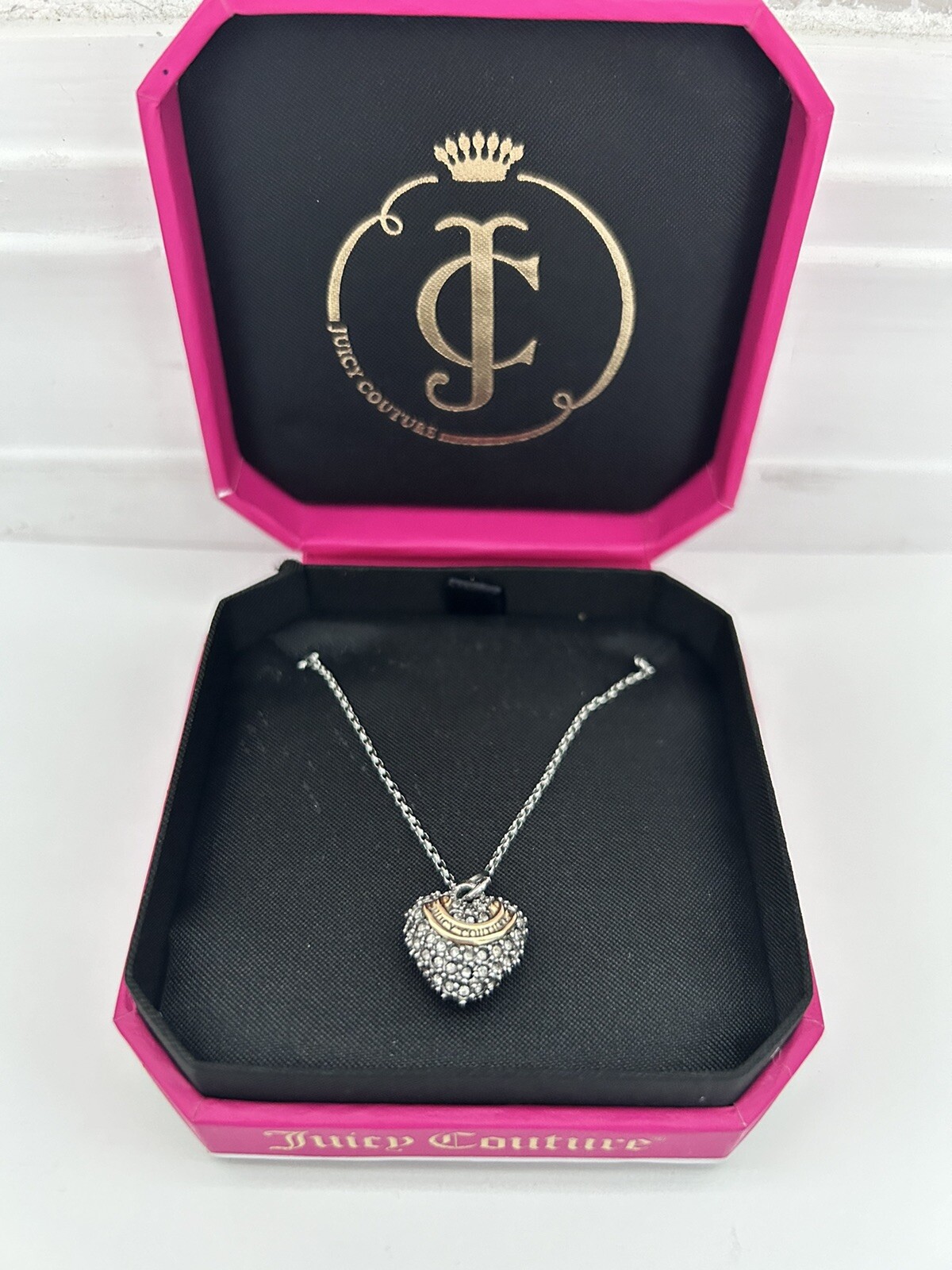 juicy couture necklace/earrings.slightly used. silver heart earrings included.