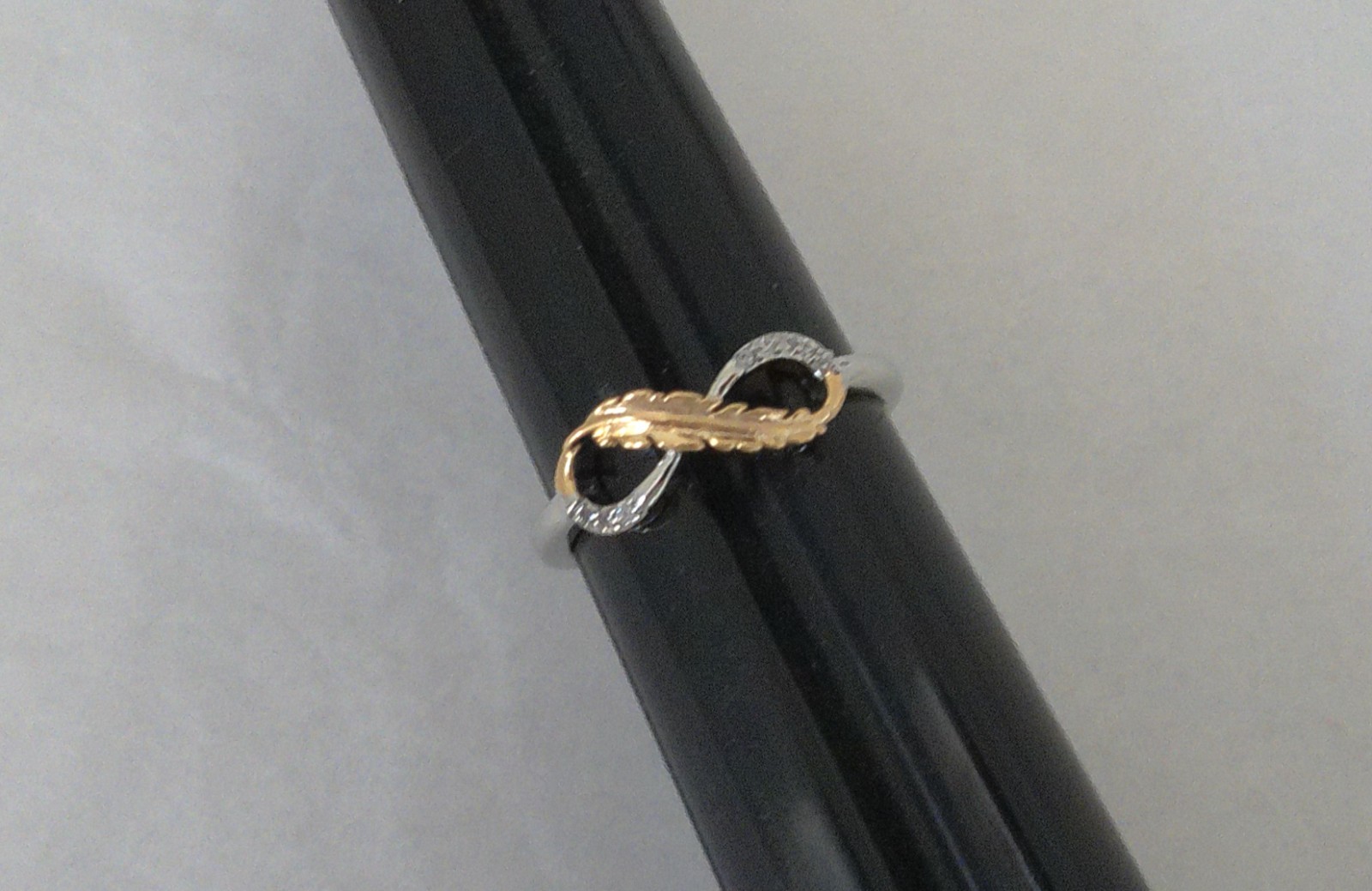 New Silvertone Eternal Infinity Loop with Goldtone Feather Accent Ring Size 7.75