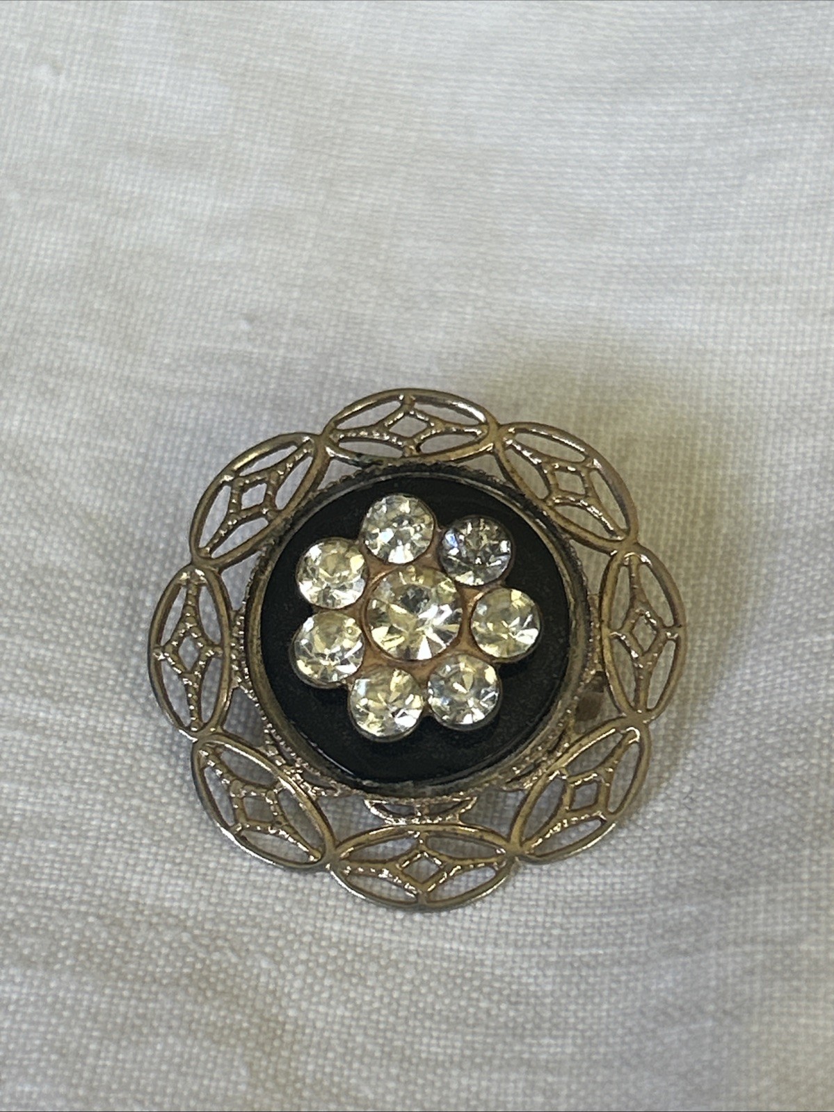 Petite Brooch Rhinestone Pin On Delicate Gold Tone Pressed Tin Filagree