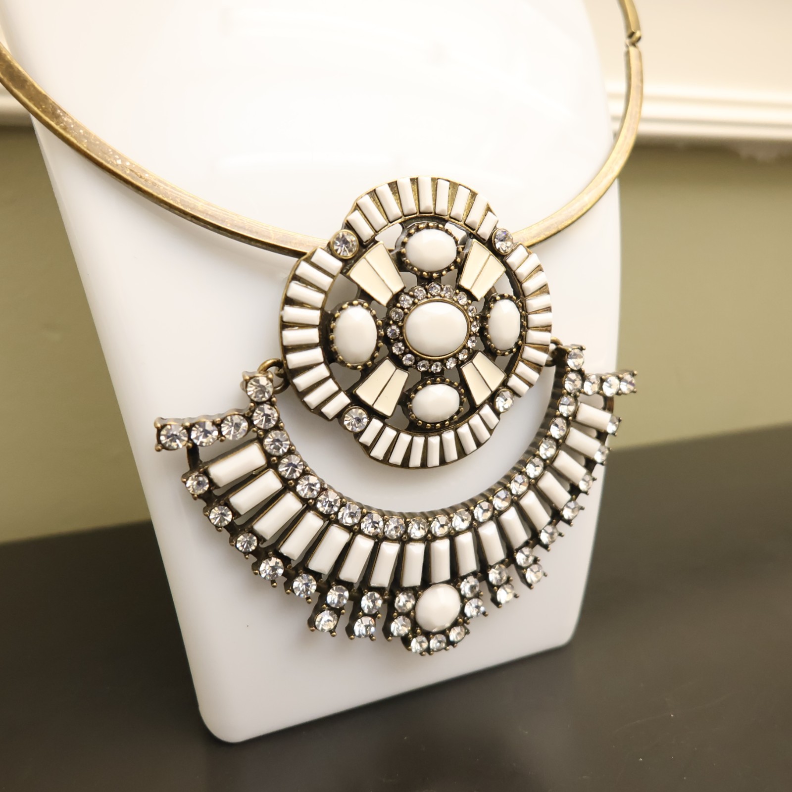 Logo Links necklace Lori Goldstein ivory crystals statement collar bronzetone
