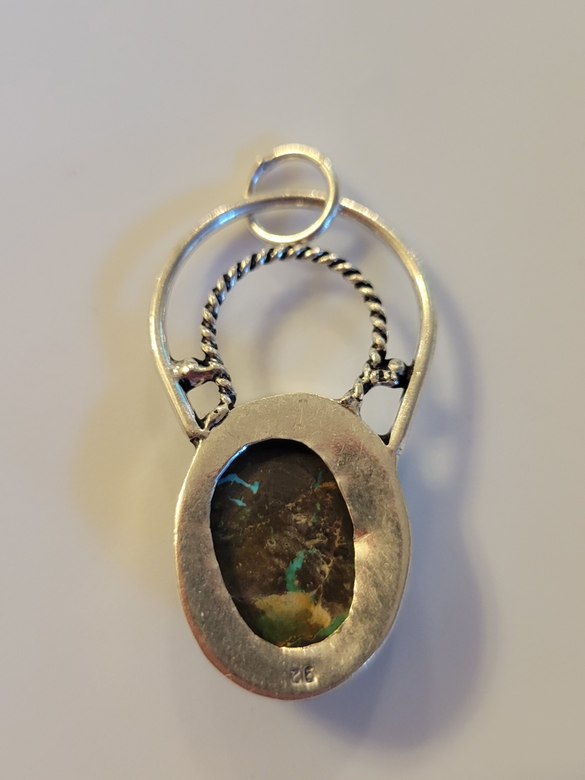 New 925 sterling silver pendant featuring an oval turquoise with Dark Matrix