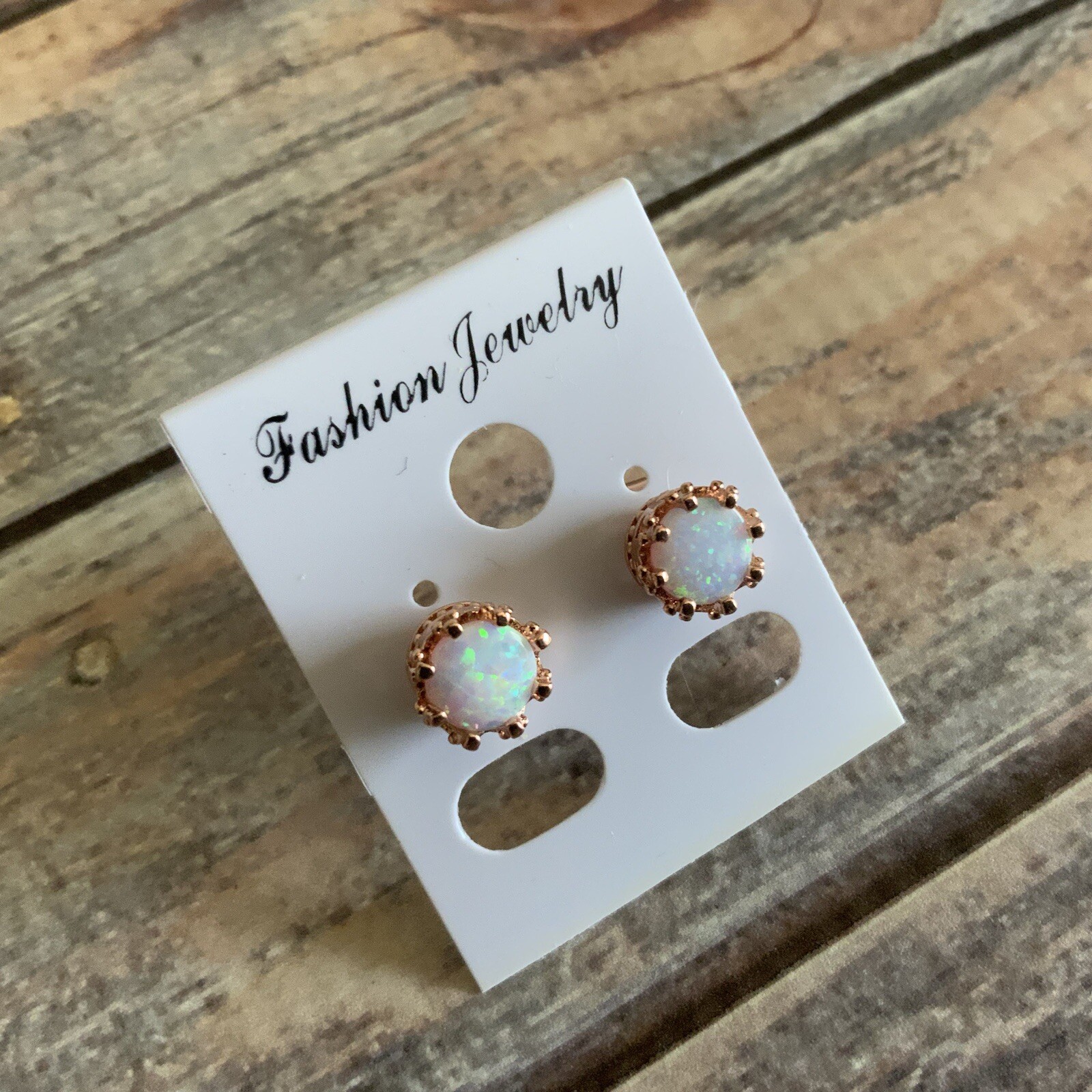 Man made faux opal crown setting rose gold colored stud earrings