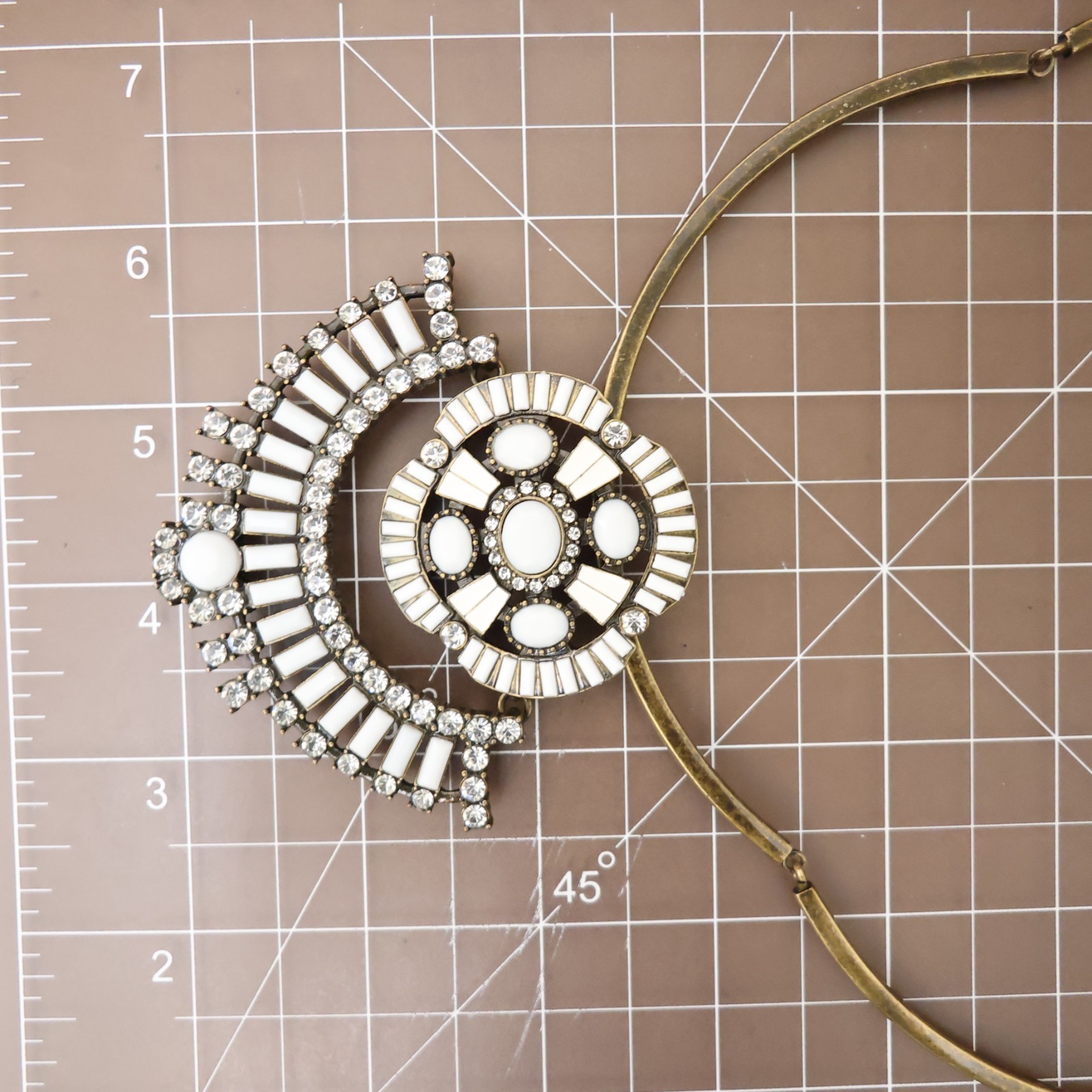 Logo Links necklace Lori Goldstein ivory crystals statement collar bronzetone
