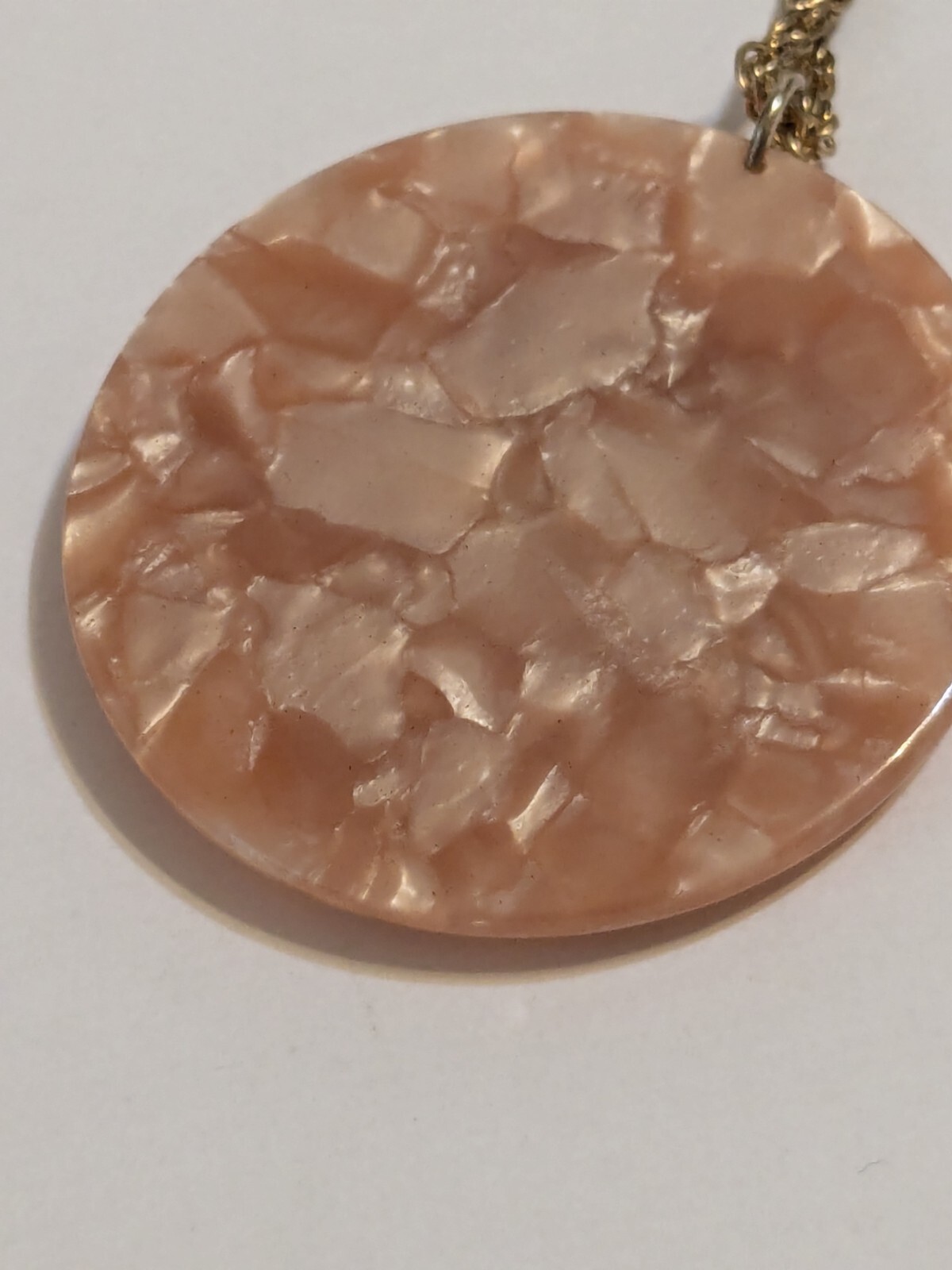 Peach Faux Shell Medallion Pendant Gold Tone Necklace. Metal Scroll Work. 30″.