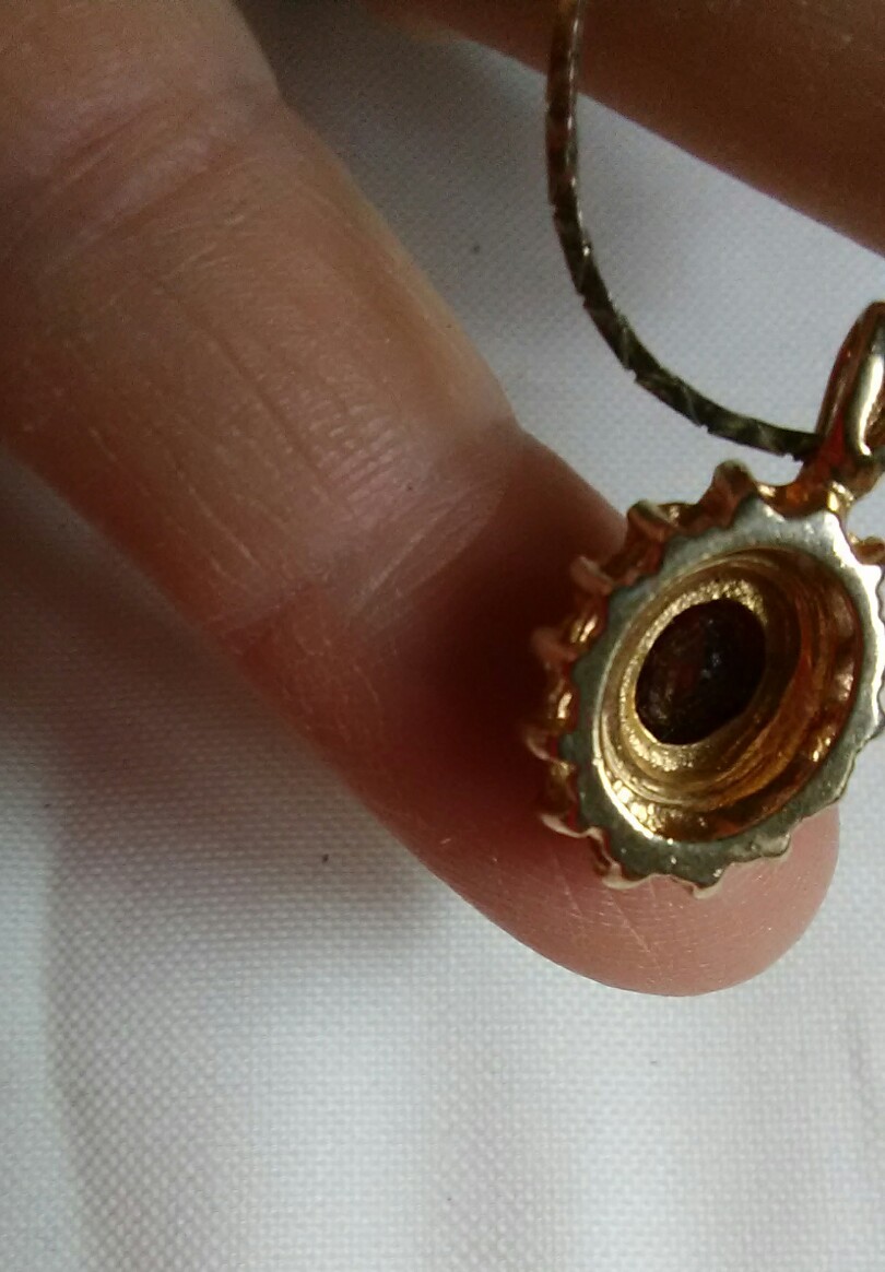 Garnet surrounded by cubic zerconia pendant January birthstone