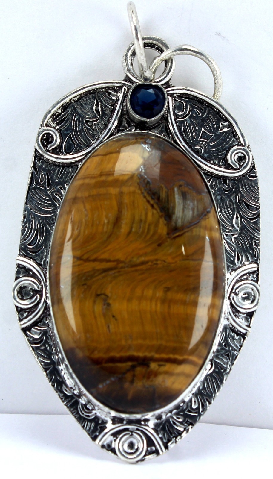Handcrafted Sterling Silver Natural Tiger’s Eye Pendant – Blue Sapphire Accent