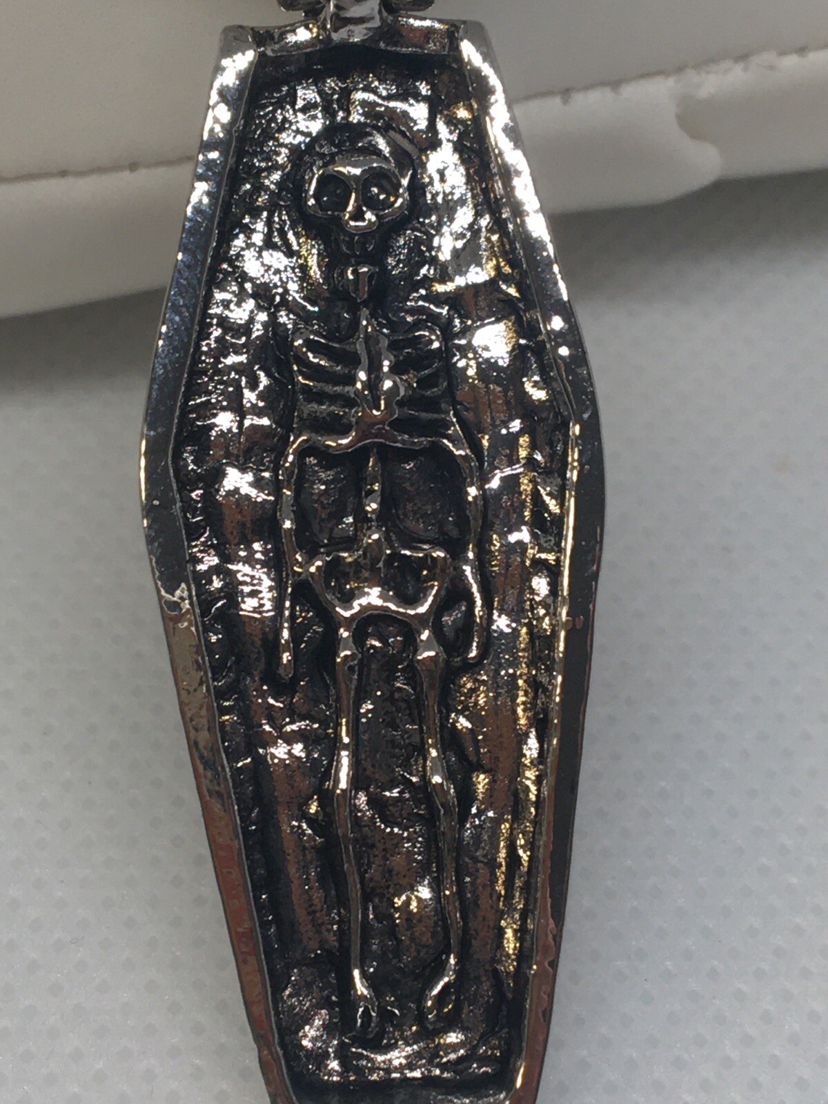 Feeling ghoulish? This coffin necklace is for you. Opens to skeleton remains.