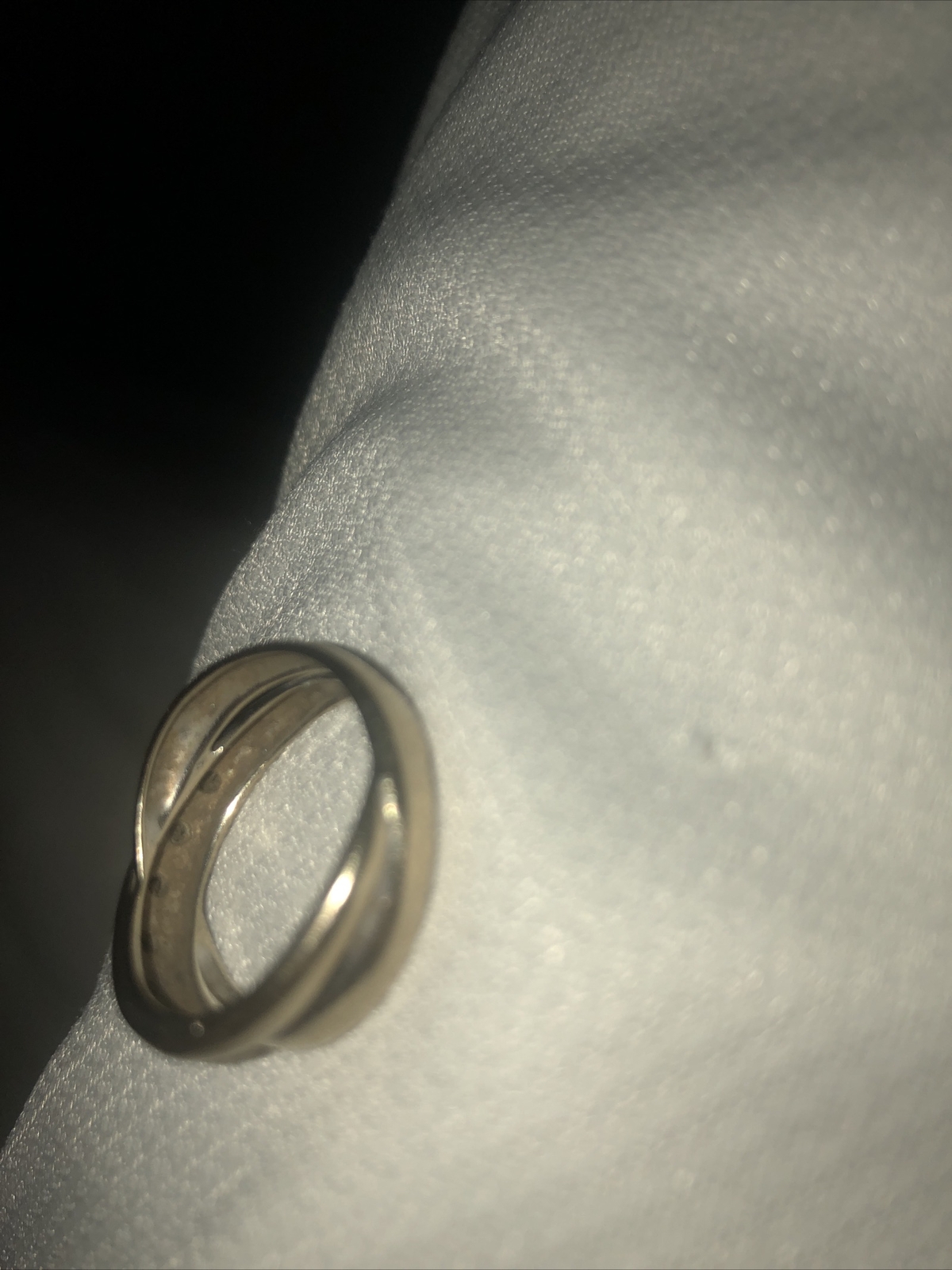 ALL SILVER RING, NOT SURE OF SIZE, CONFIRMED BY A JEWLERY STORE