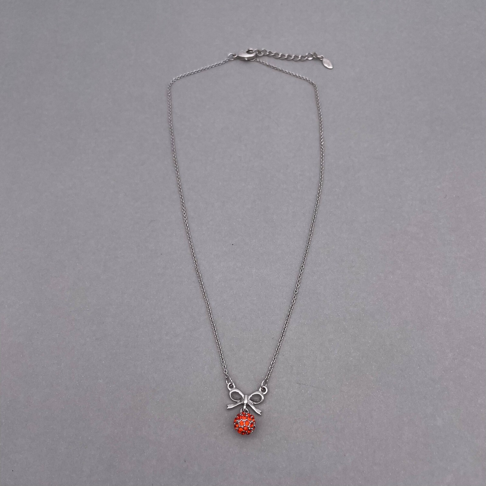 Clue Rhinestone Ball and Bow Link Chain Necklace Silver Tone 15 to 17 in
