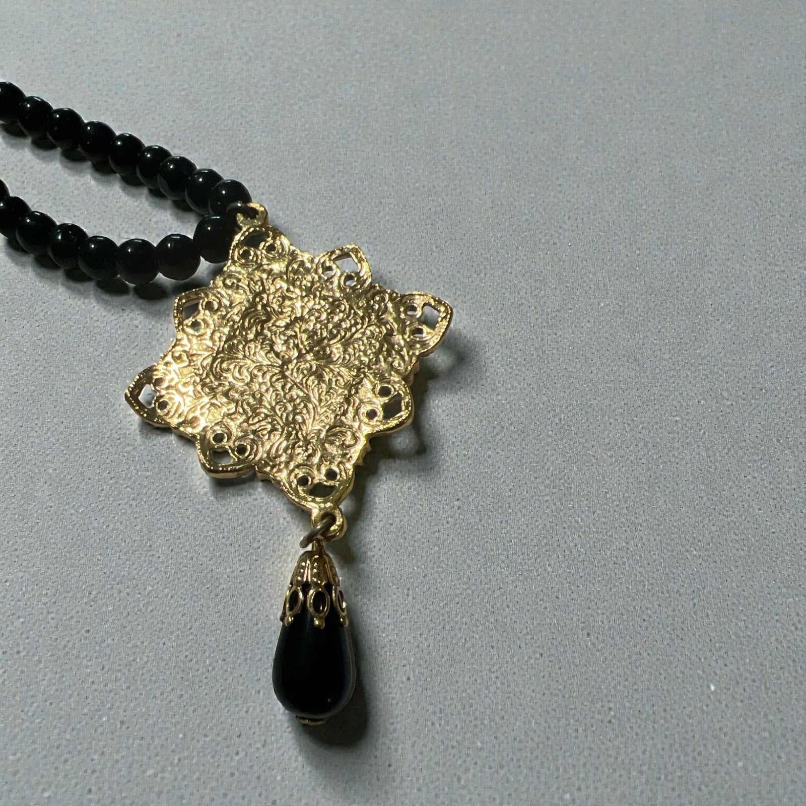 Vintage 1928 Jewelry Co with Black Beads and Gold-tone Pendant w/Pink Rose