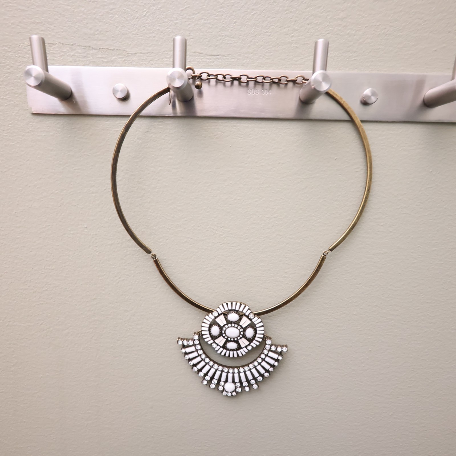 Logo Links necklace Lori Goldstein ivory crystals statement collar bronzetone