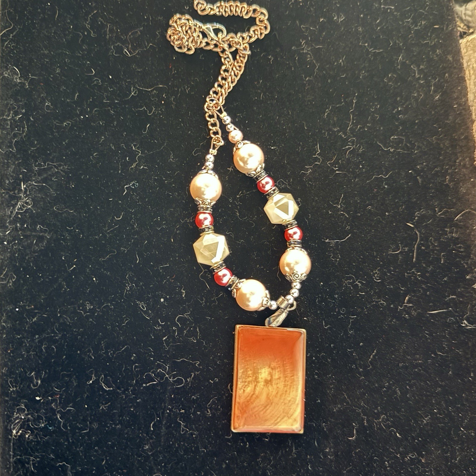 Silver tone red & white beaded necklace w/ orange rectangle charm, adjustable