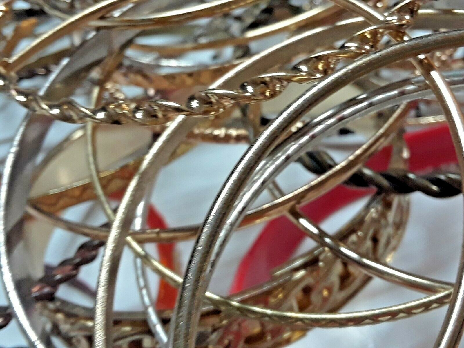 Bangle bracelets. gold tone silver tone, metal, plastic, with patterns. Lot