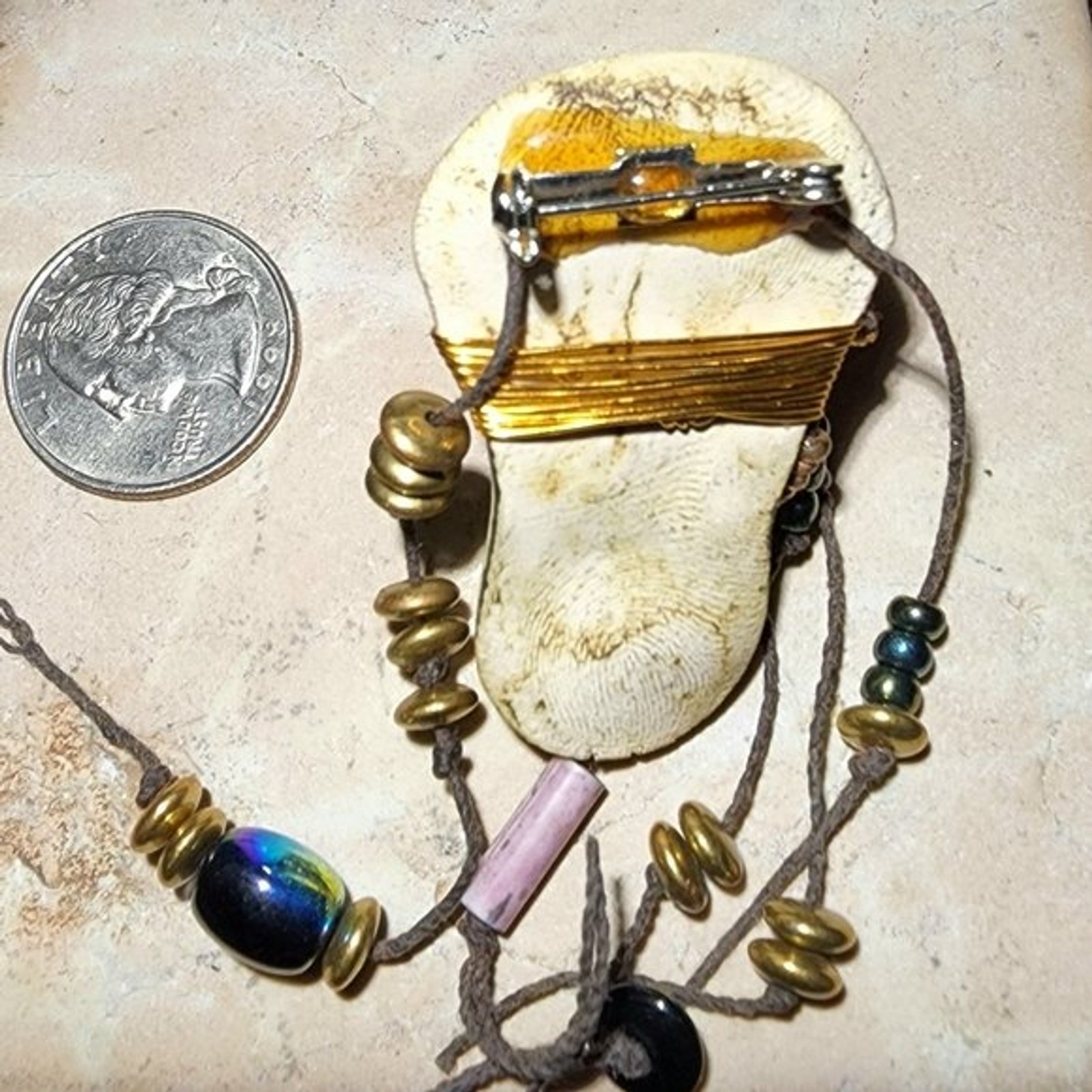 Abstract tribal brutalist face with locs like hair artisan brooch