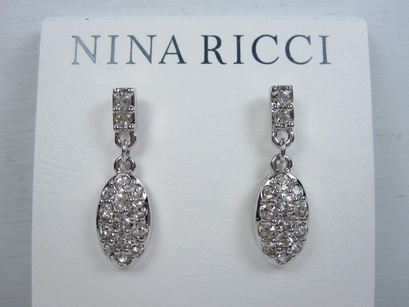 Nina Ricci Rhodium Plated Pierced Earrings with Swarovski Crystals – 9582