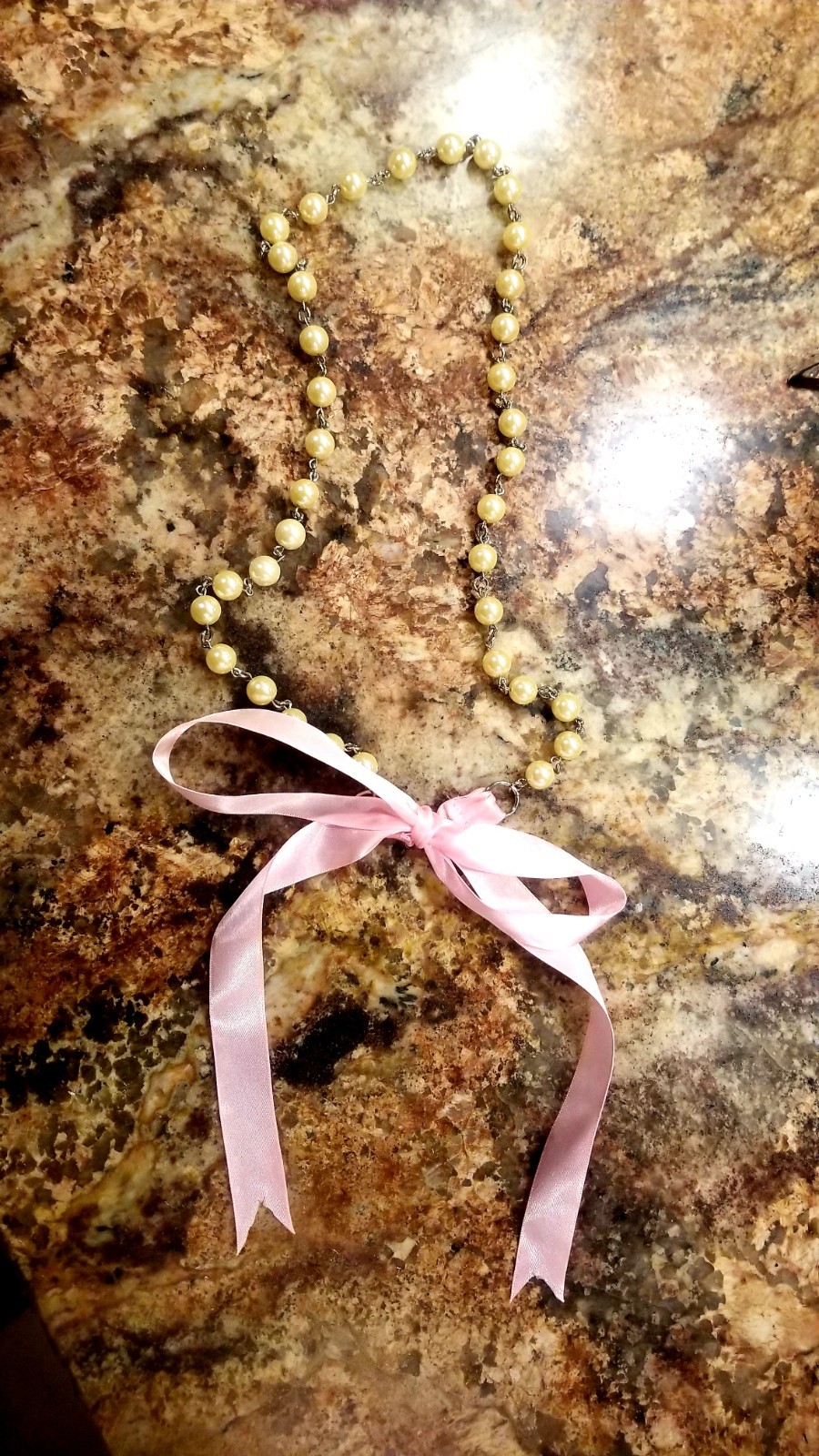 Strand of old fashioned 1960s Pearl’s with pink silk ribbon necklace/belt