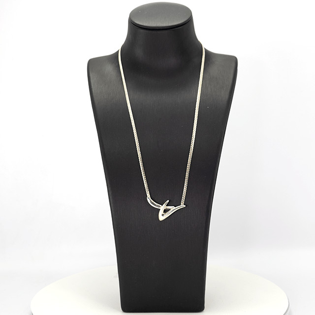 Abstract silver necklace with modern sculptural design