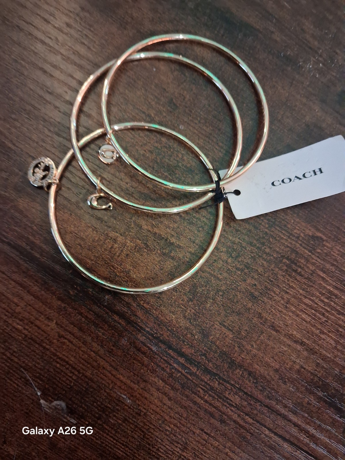 Coach NWT Gold Tone Stackable Bangle Bracelet Set, 3pc Logo With Dangle Charms