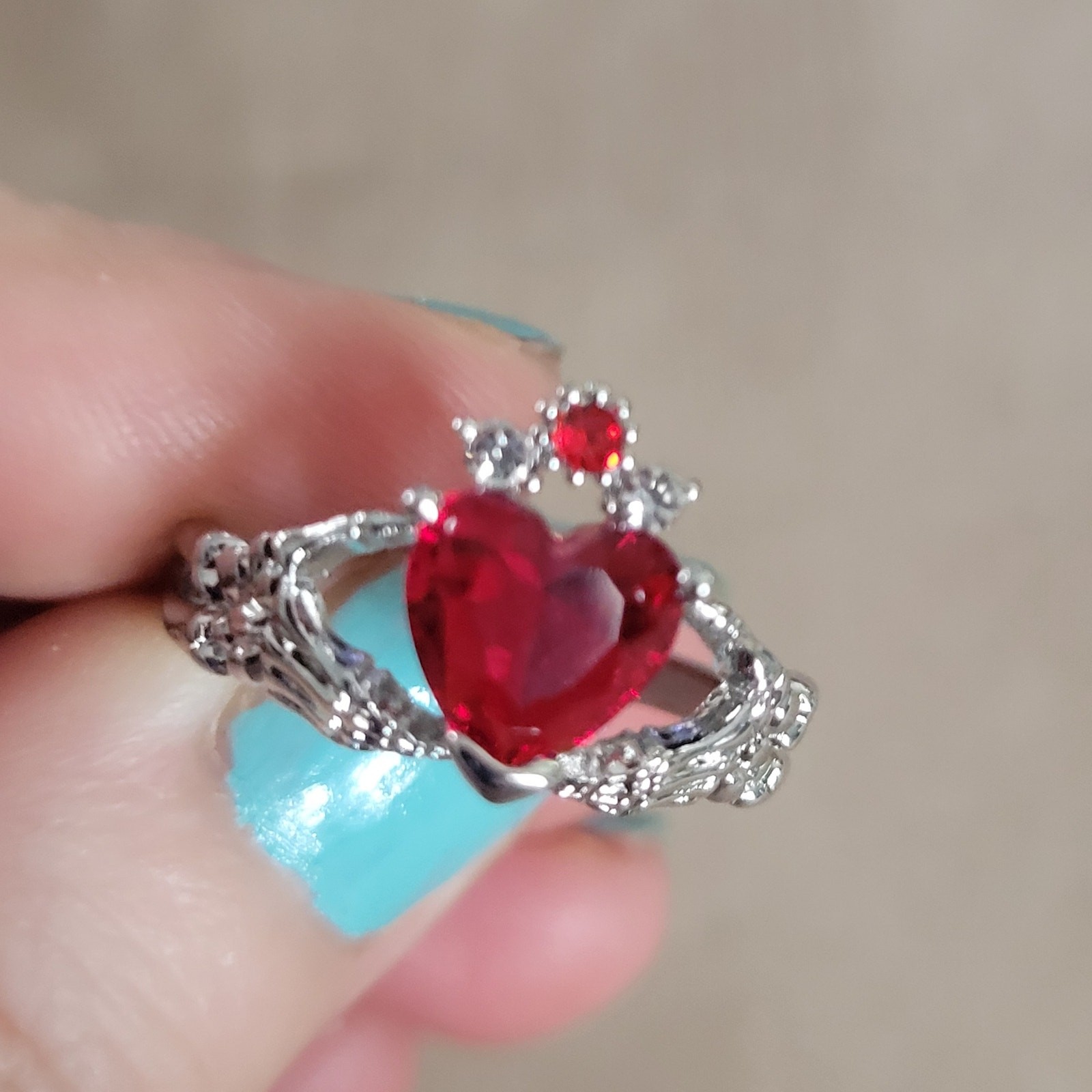 Size 7 gothic claddagh ring, skeleton hands holding red crystal heart