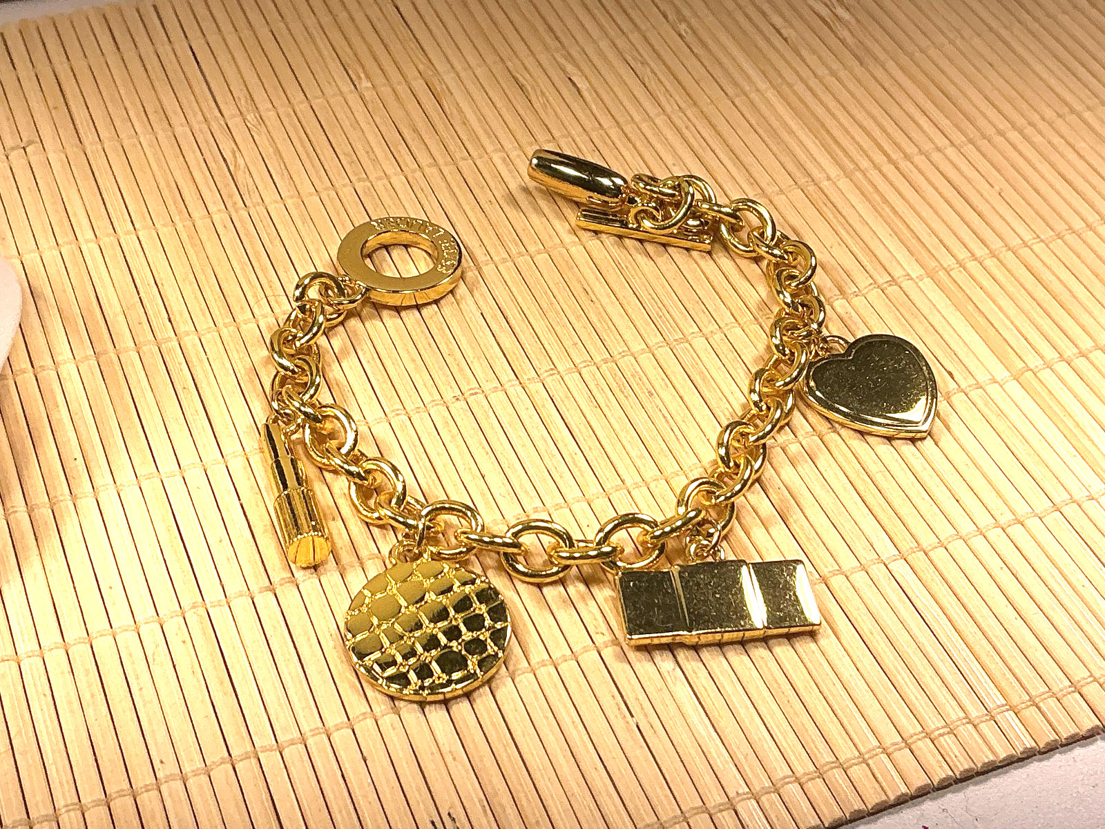 Estee Lauder Bracelet Cast Gold Tone Charms Heart Lipstick Perfume Purse Lot 90A
