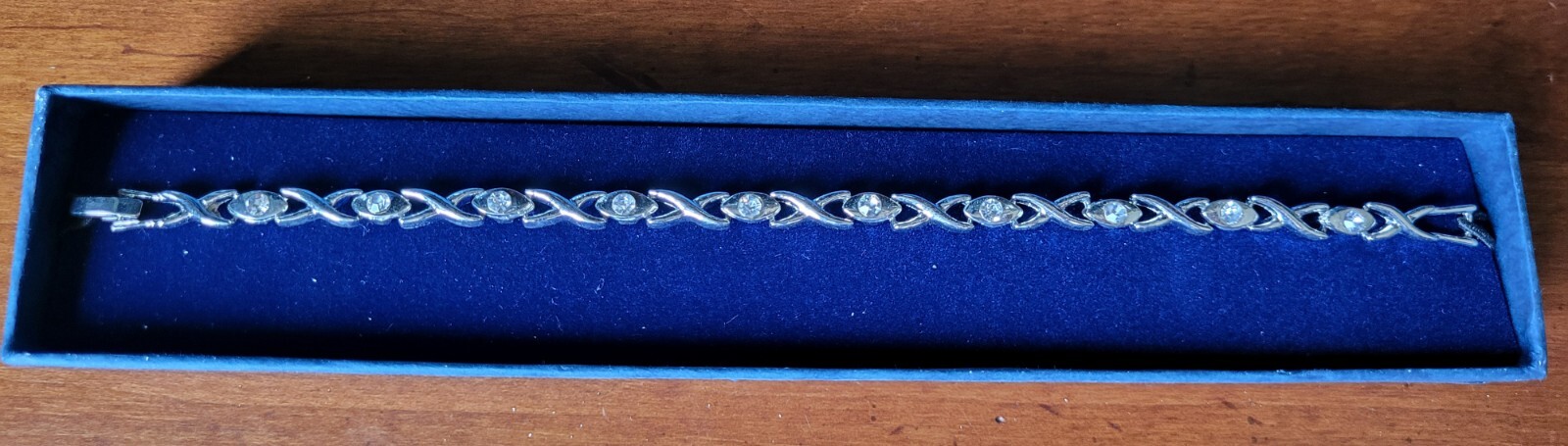 Silver color Crisscross Bracelet with clear stones – approx. 8″ – NEW in box
