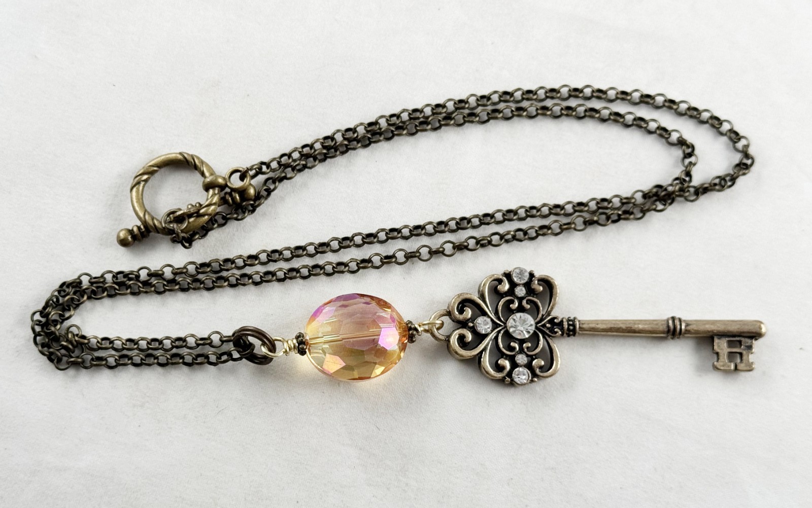 Antique bronze color chain necklace with Amber crystal and ornate key