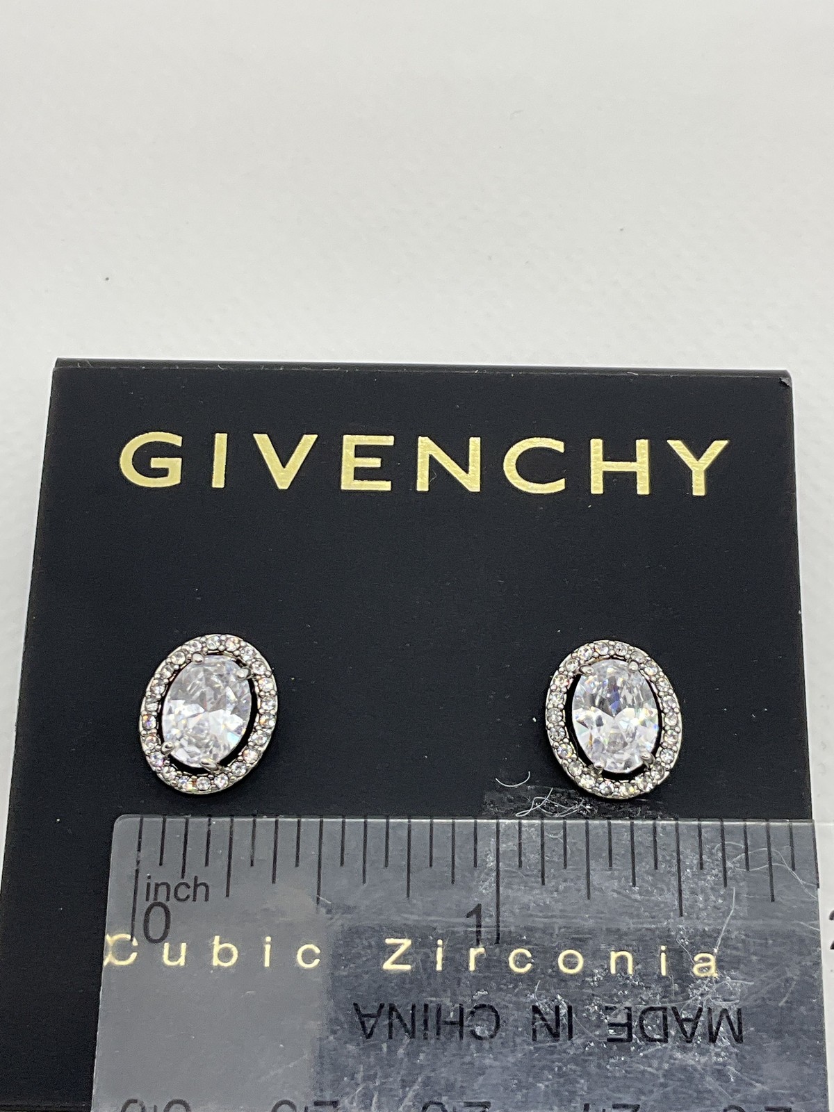 Givenchy Silver Tone Cubic Zirconia Oval Halo Stud Earrings